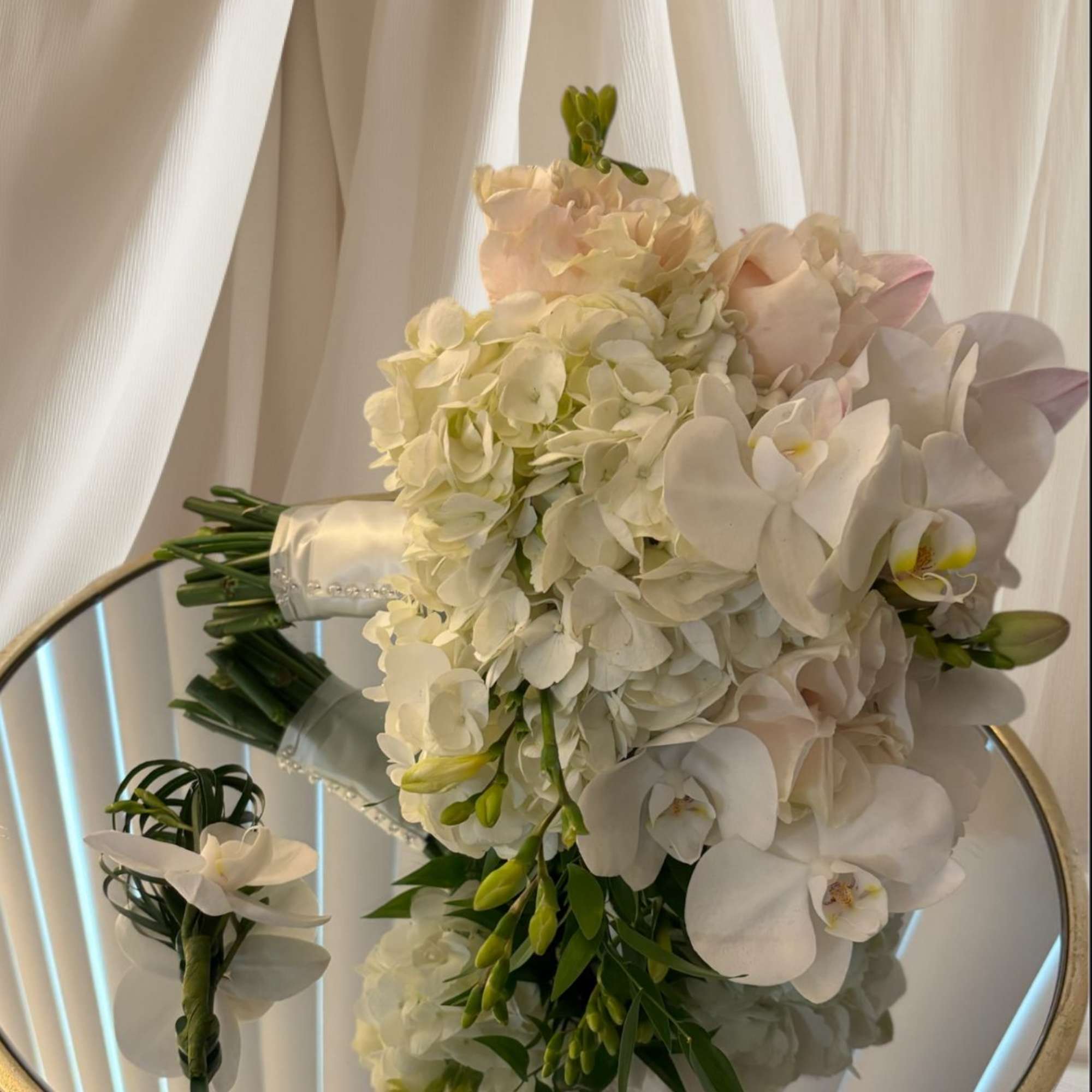 White bridal bouquet with orchids and hydrangeas, photo 3 of 3