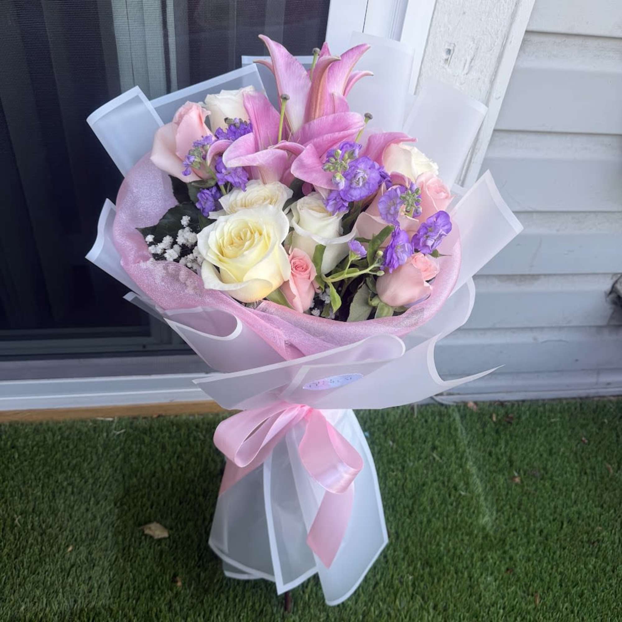 A delicate arrangement blending the purity of white roses, the sweetness of, photo 2 of 2