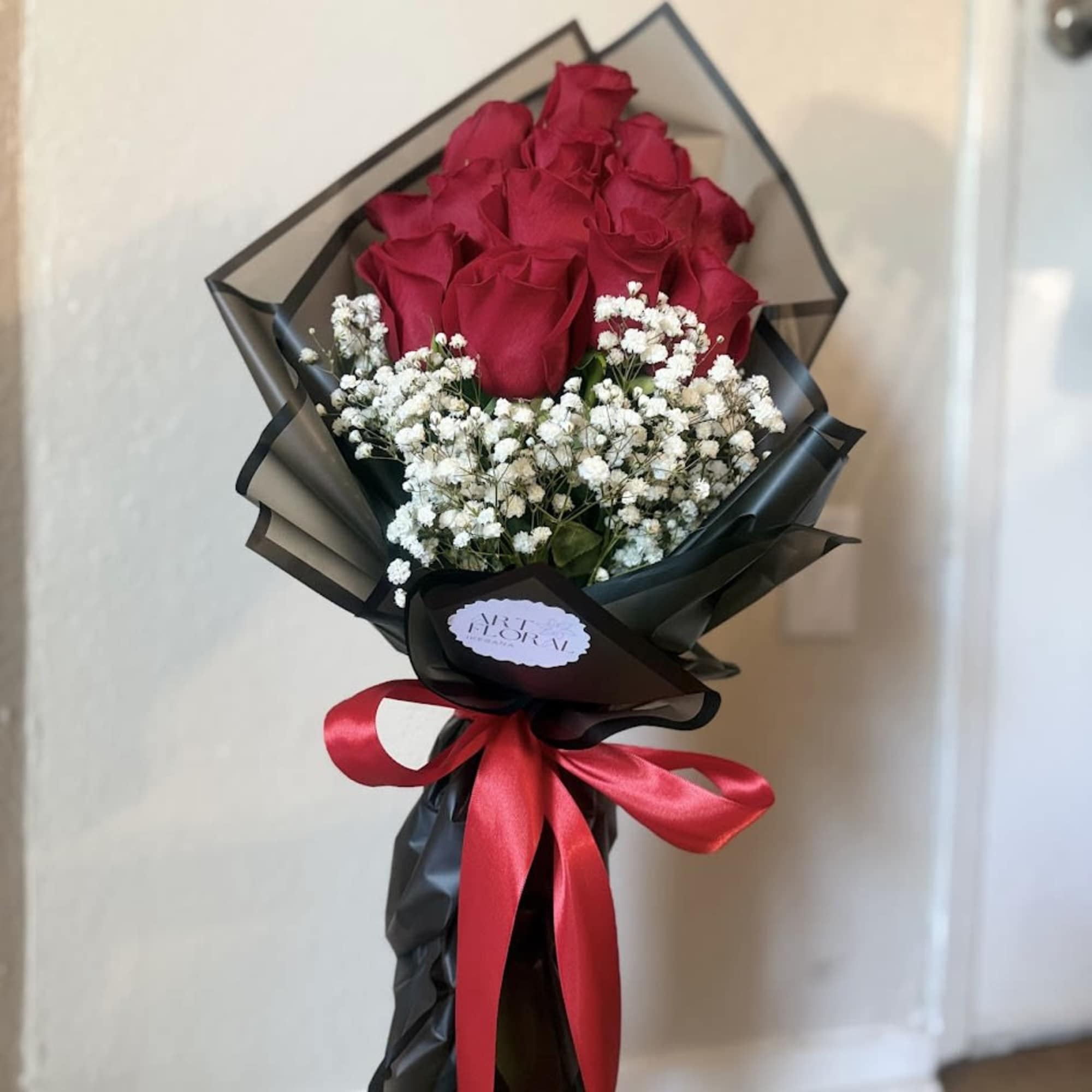 An elegant arrangement of fresh red roses, accompanied by delicate gypsophila that, photo 4 of 4