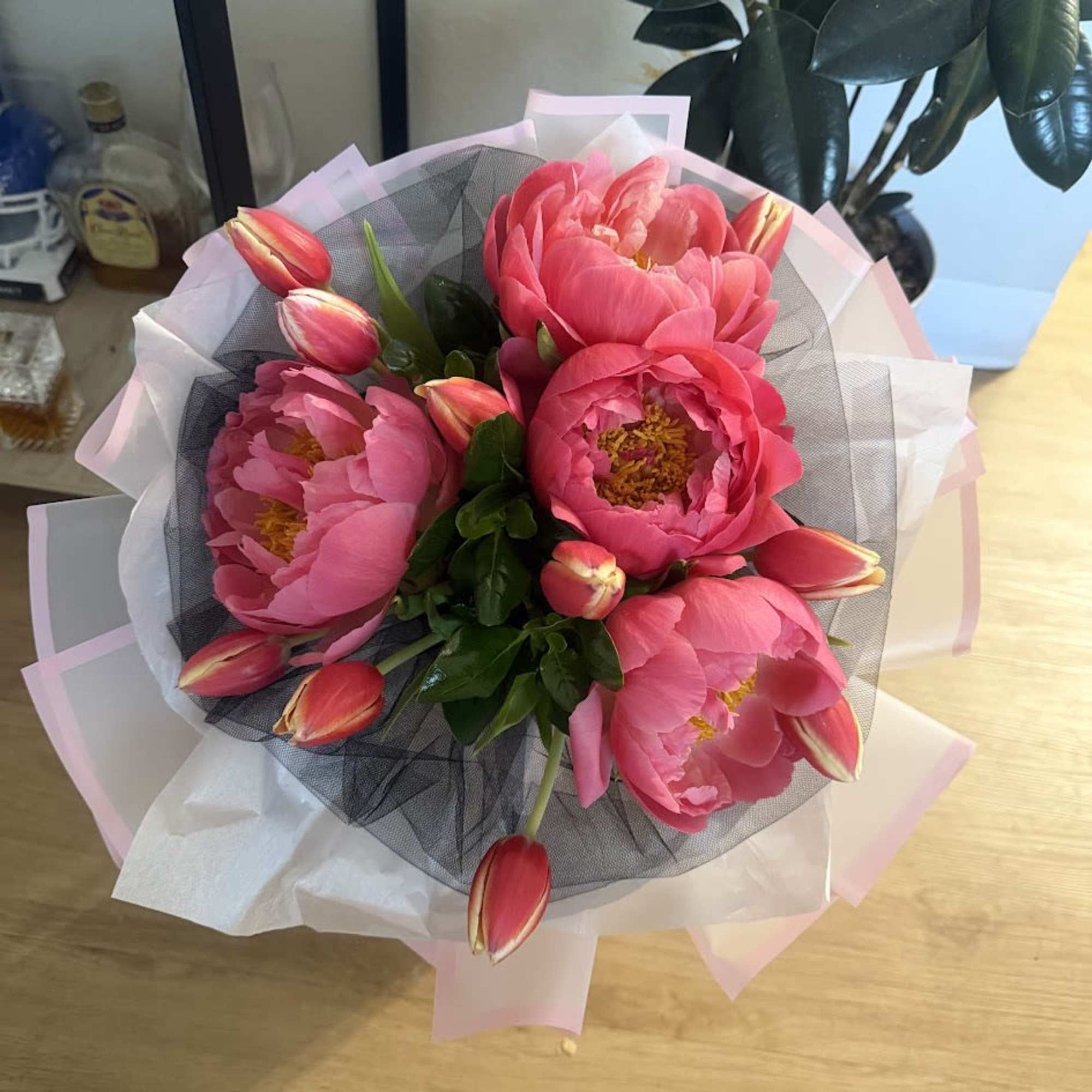 A delicate arrangement of fresh peonies and tulips wrapped in elegant Korean-style, photo 4 of 4