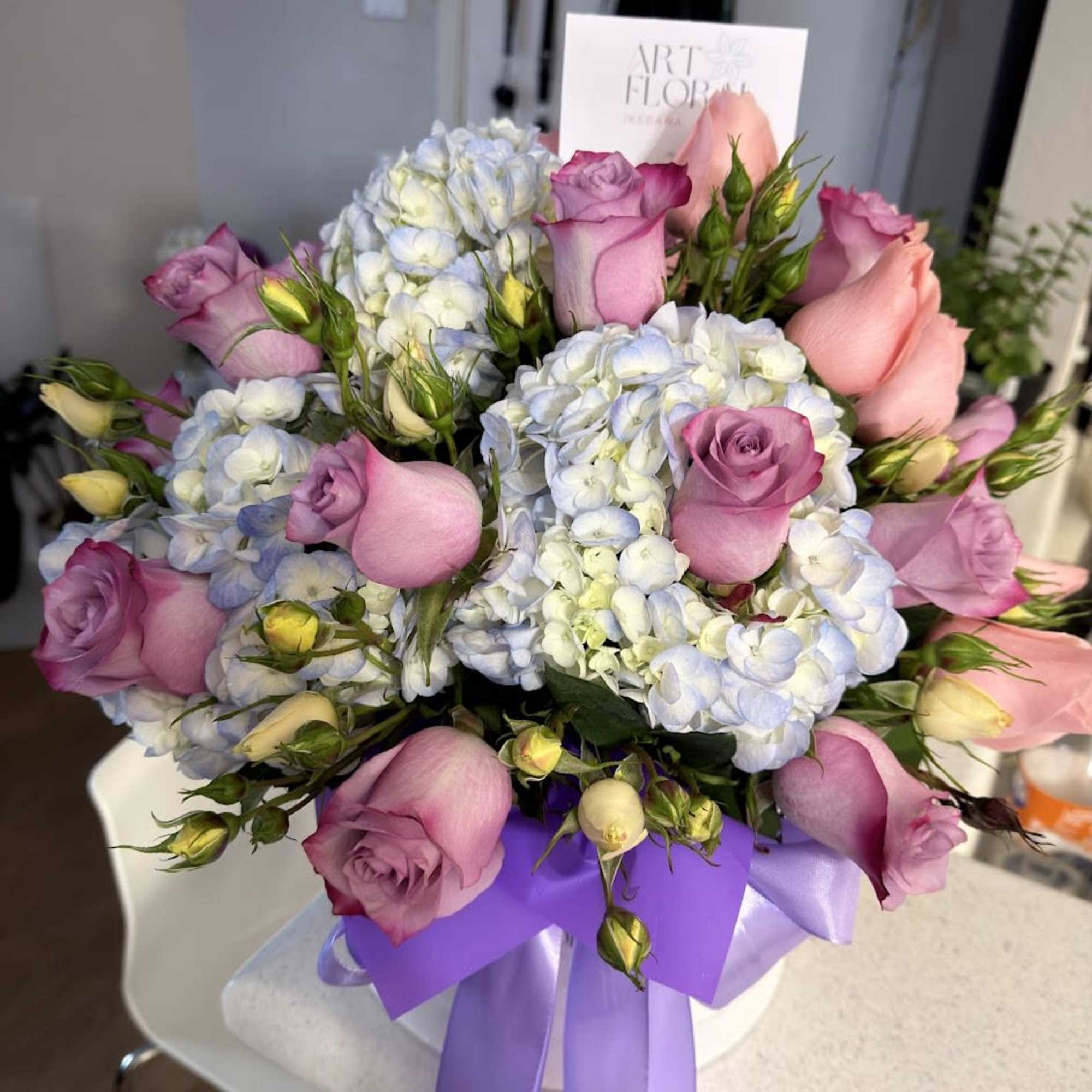 An elegant flower box featuring a beautiful blend of lavender roses, pink, photo 3 of 4