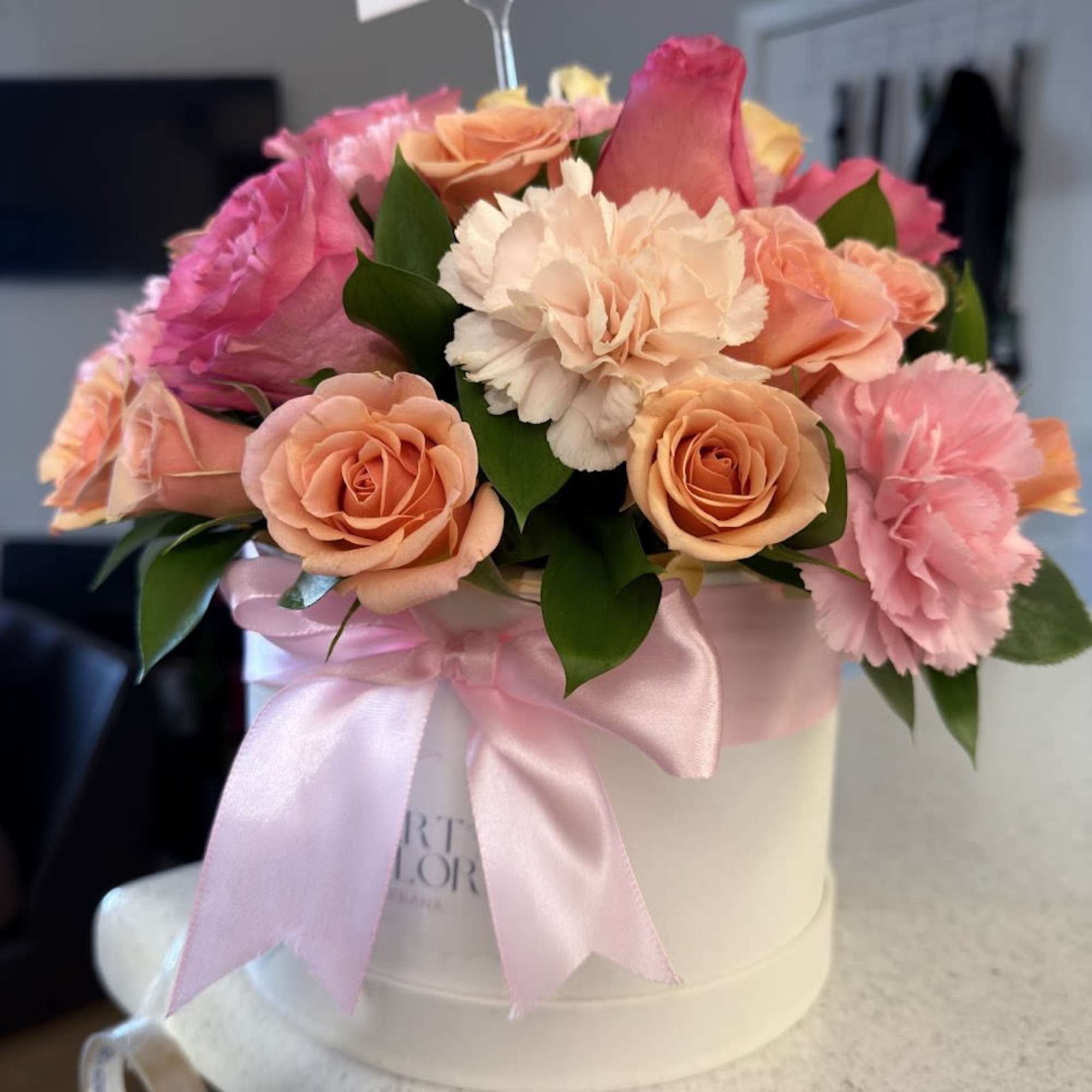 An elegant and colorful arrangement featuring carnations, orange and pink roses, beautifully, photo 2 of 5