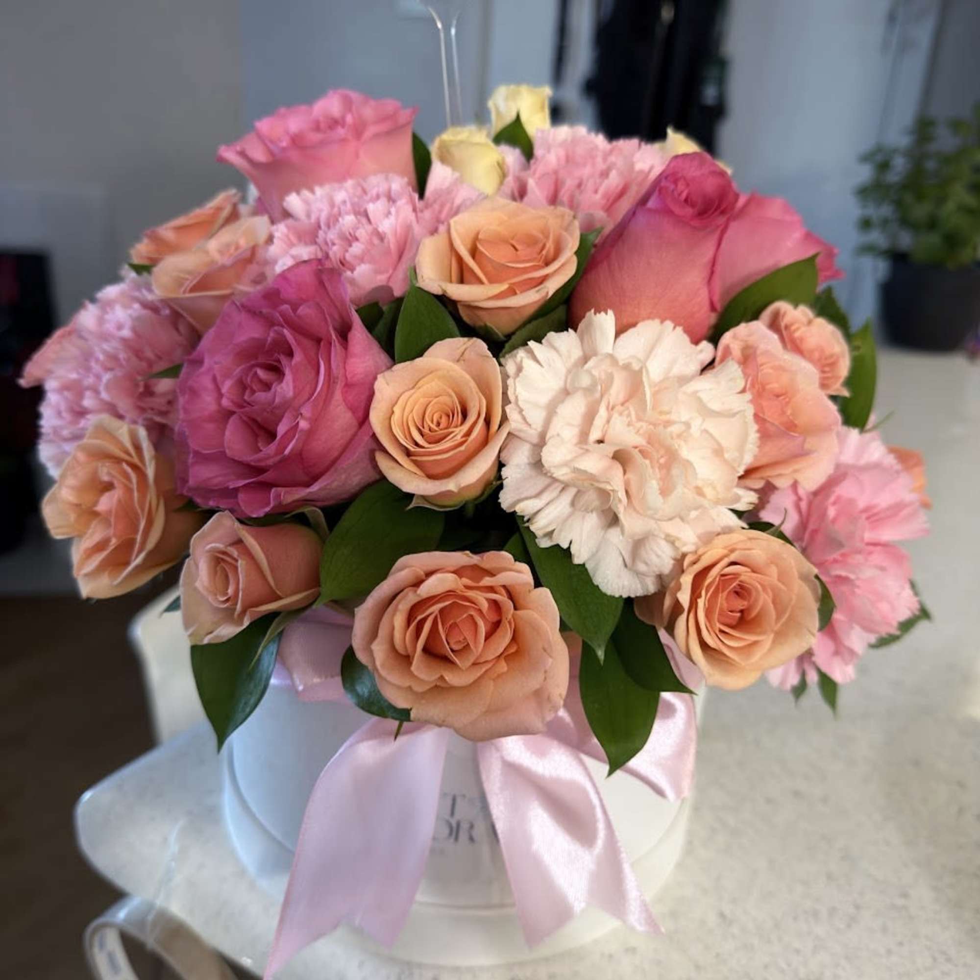 An elegant and colorful arrangement featuring carnations, orange and pink roses, beautifully, photo 3 of 5
