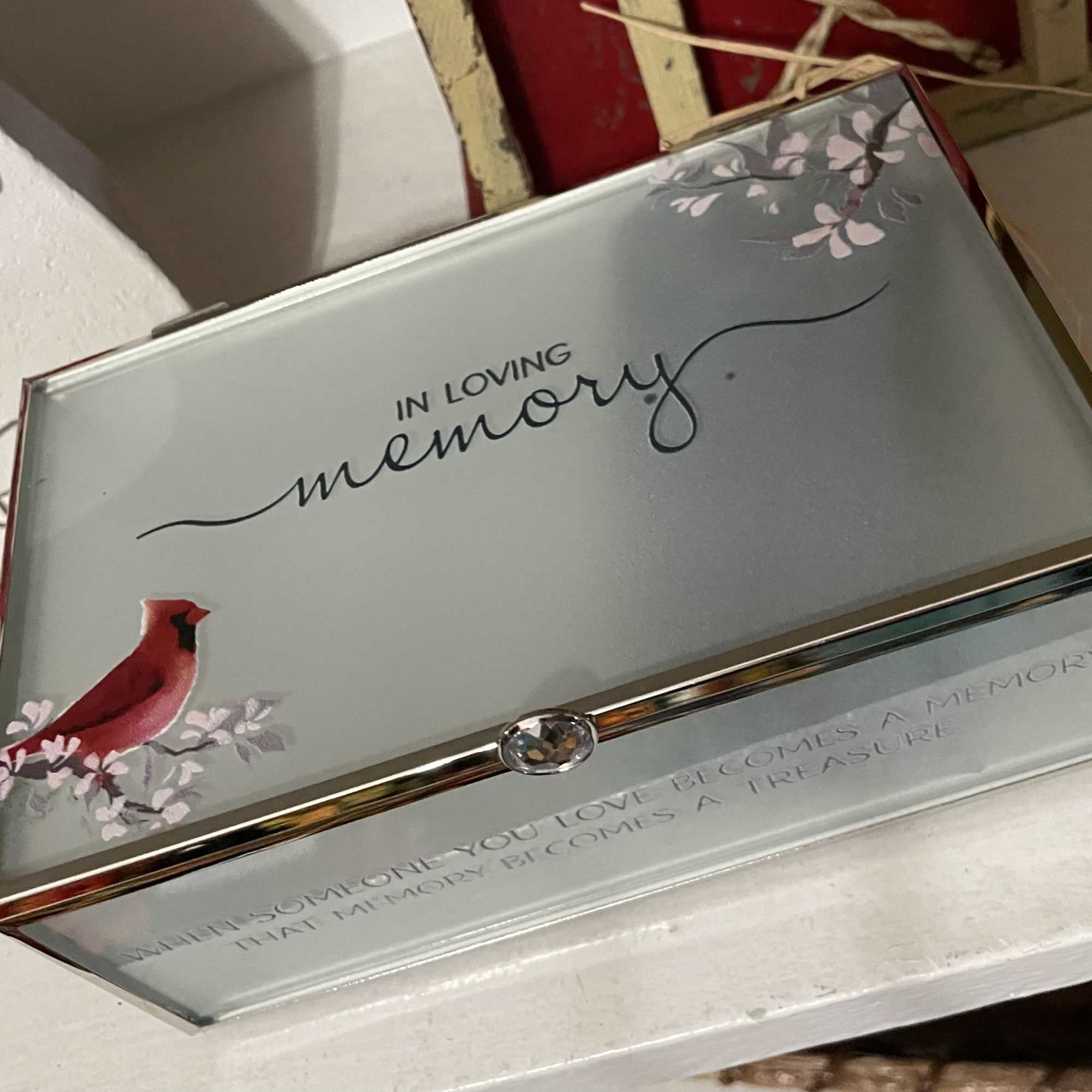 Remember a life beautifully lived with this keepsake jewelry box. Featuring a