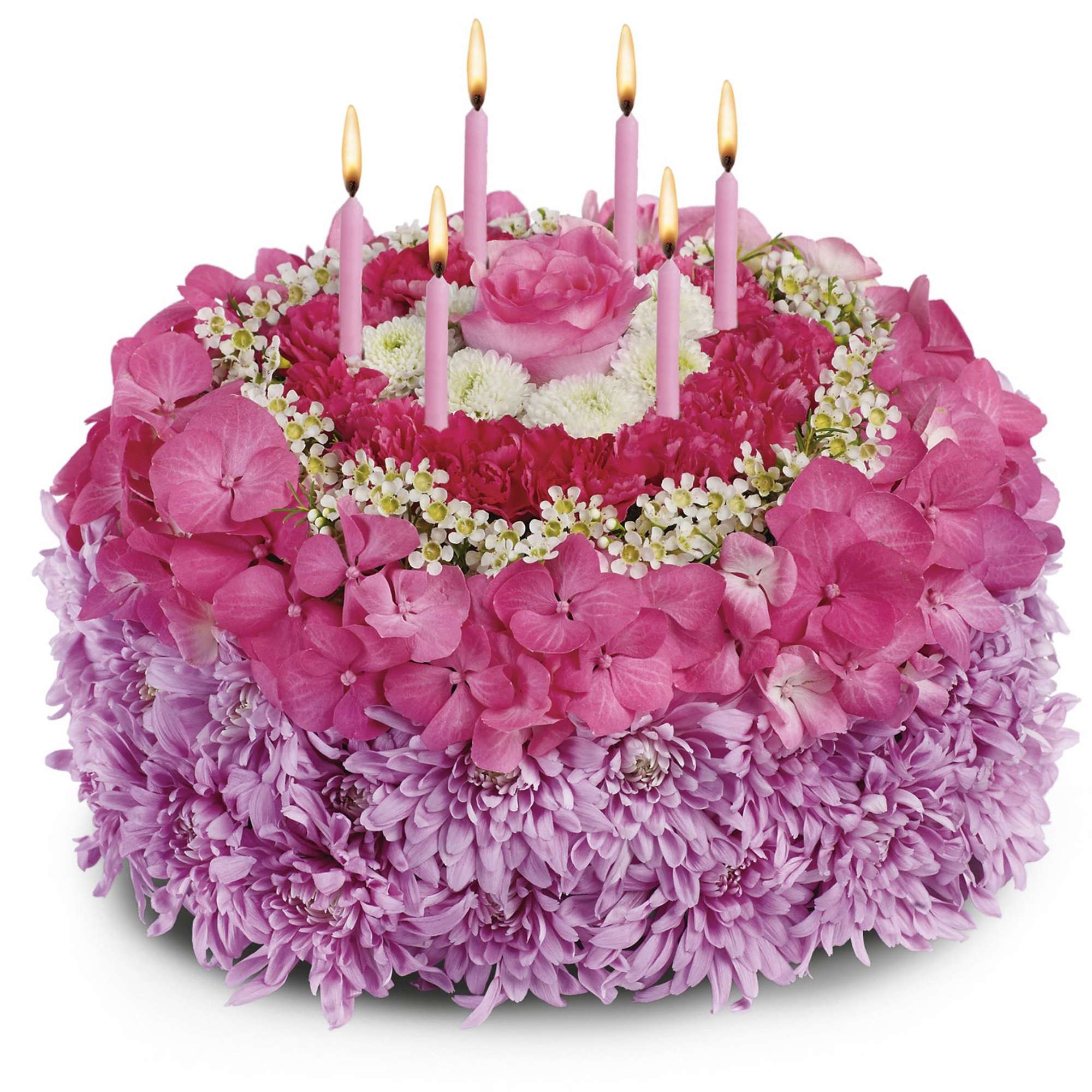 Pink floral cake with lit candles