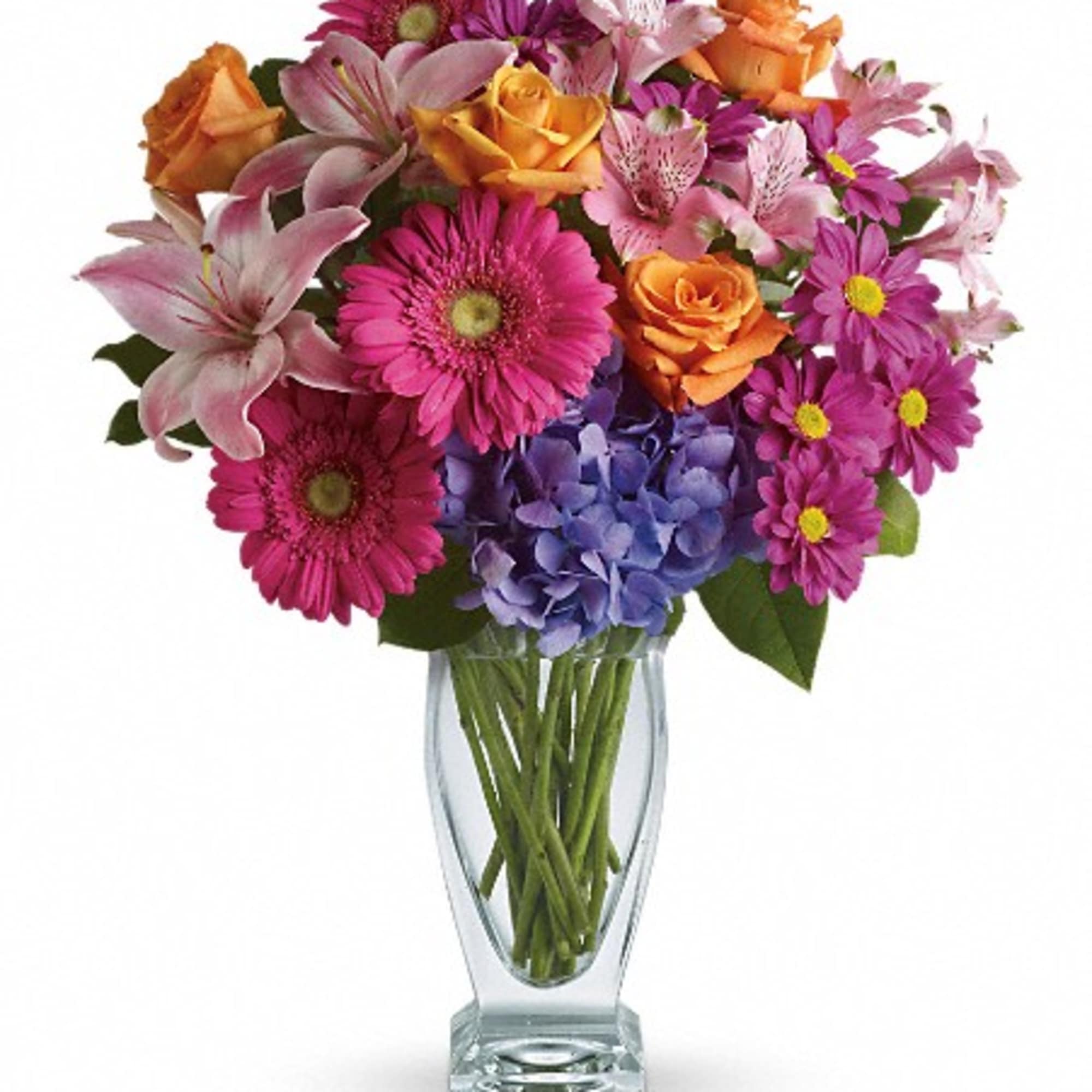 Mixed bouquet of pink, orange, and purple flowers in a clear glass vase, photo 2 of 3