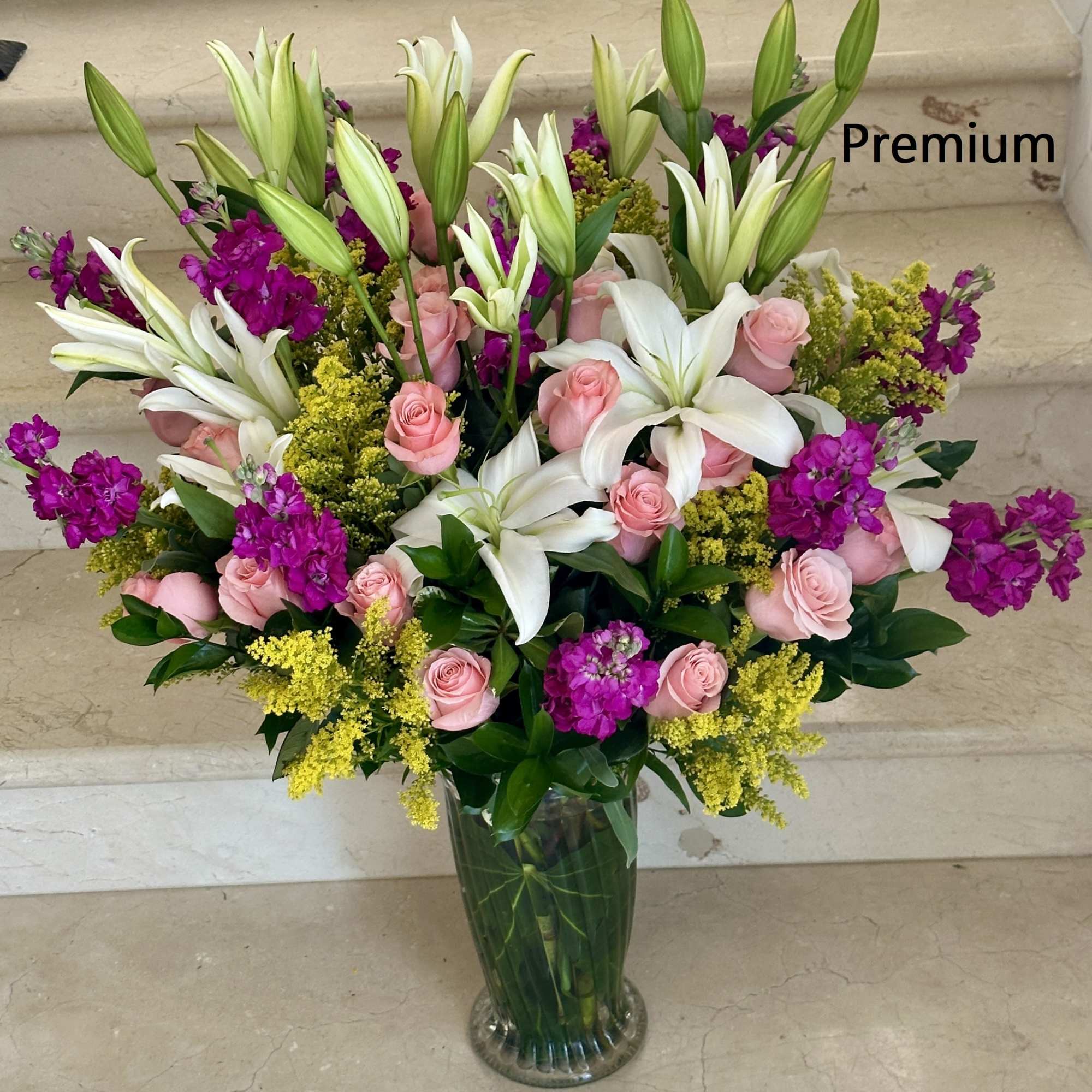 Elegant Beauty. Arranged with Roses, Lilies, fragrant Stock and other flowers and