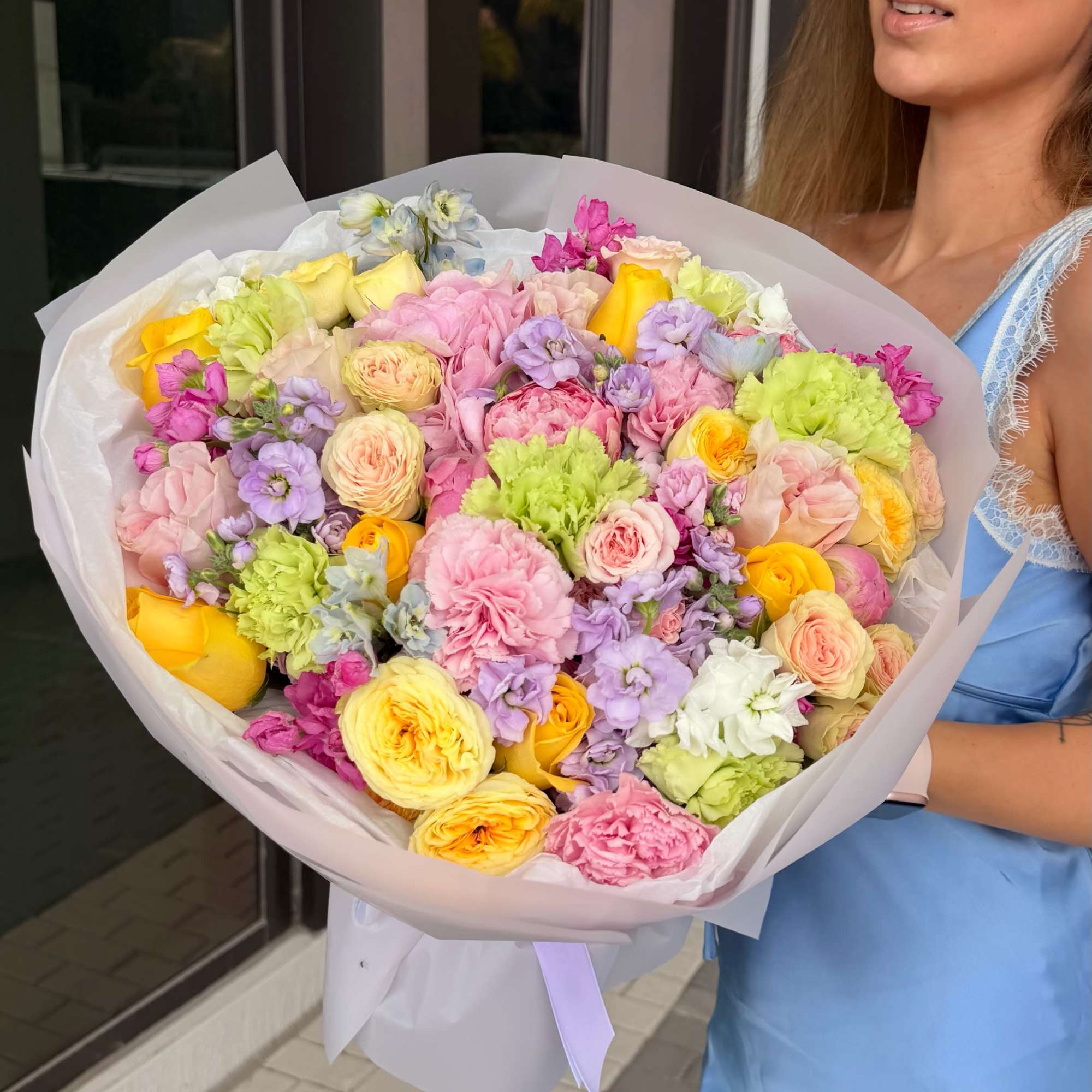A lush, romantic bouquet designed in soft pastel tones, blending the charm