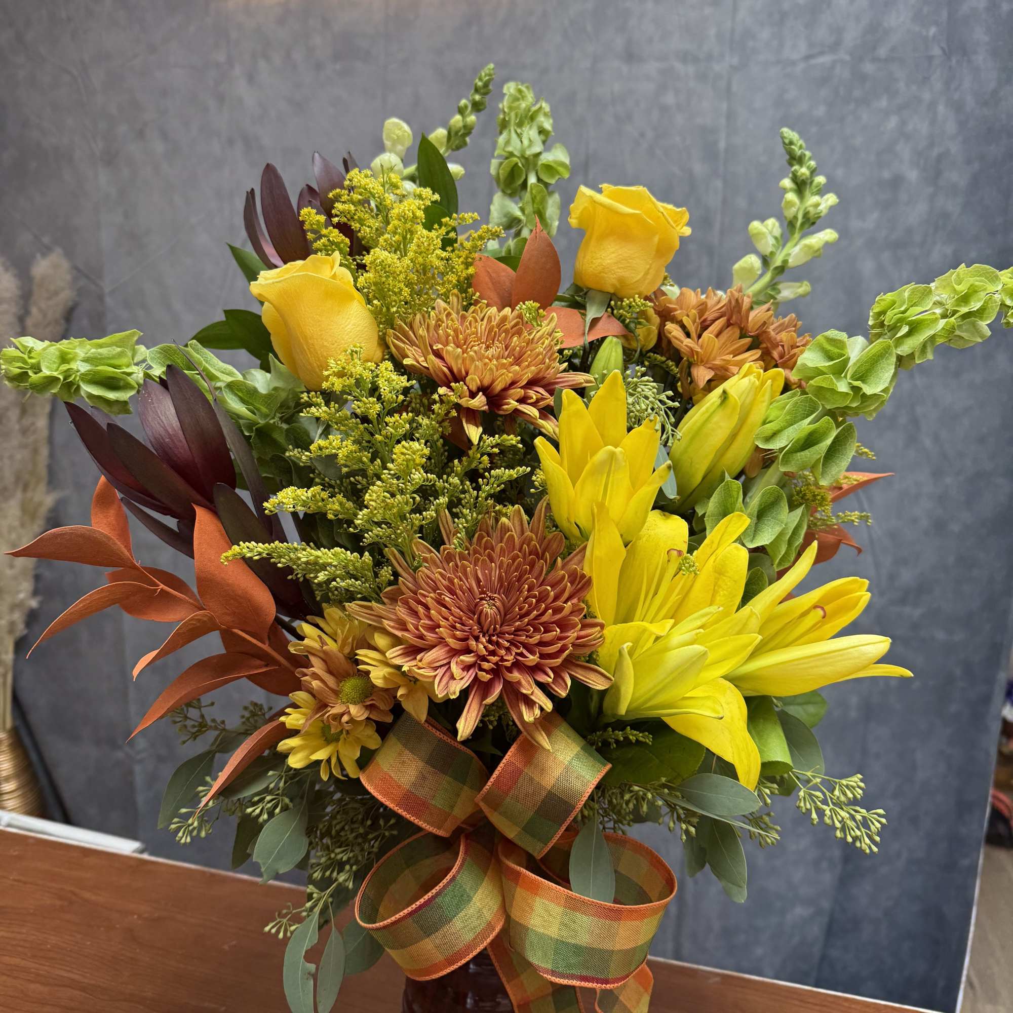 Embrace the beauty of fall with our exquisite Autumn Blooms arrangement!

Handcrafted with, photo 2 of 2