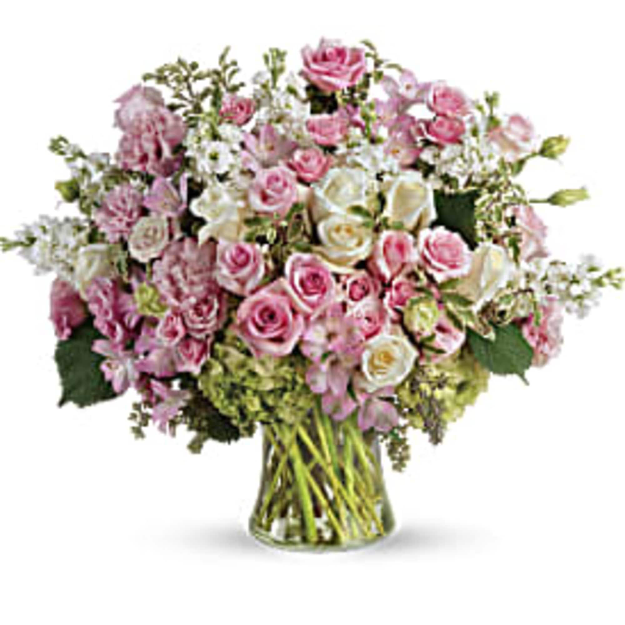Pink and white rose bouquet in a clear glass vase