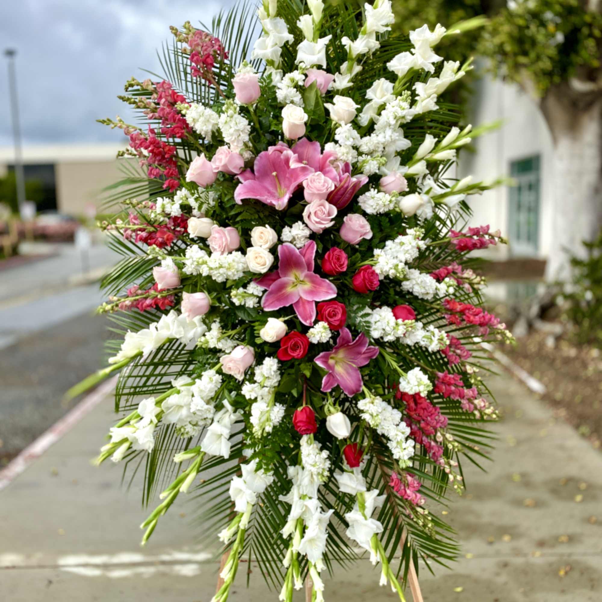 Large standing floral spray with pink and white flowers