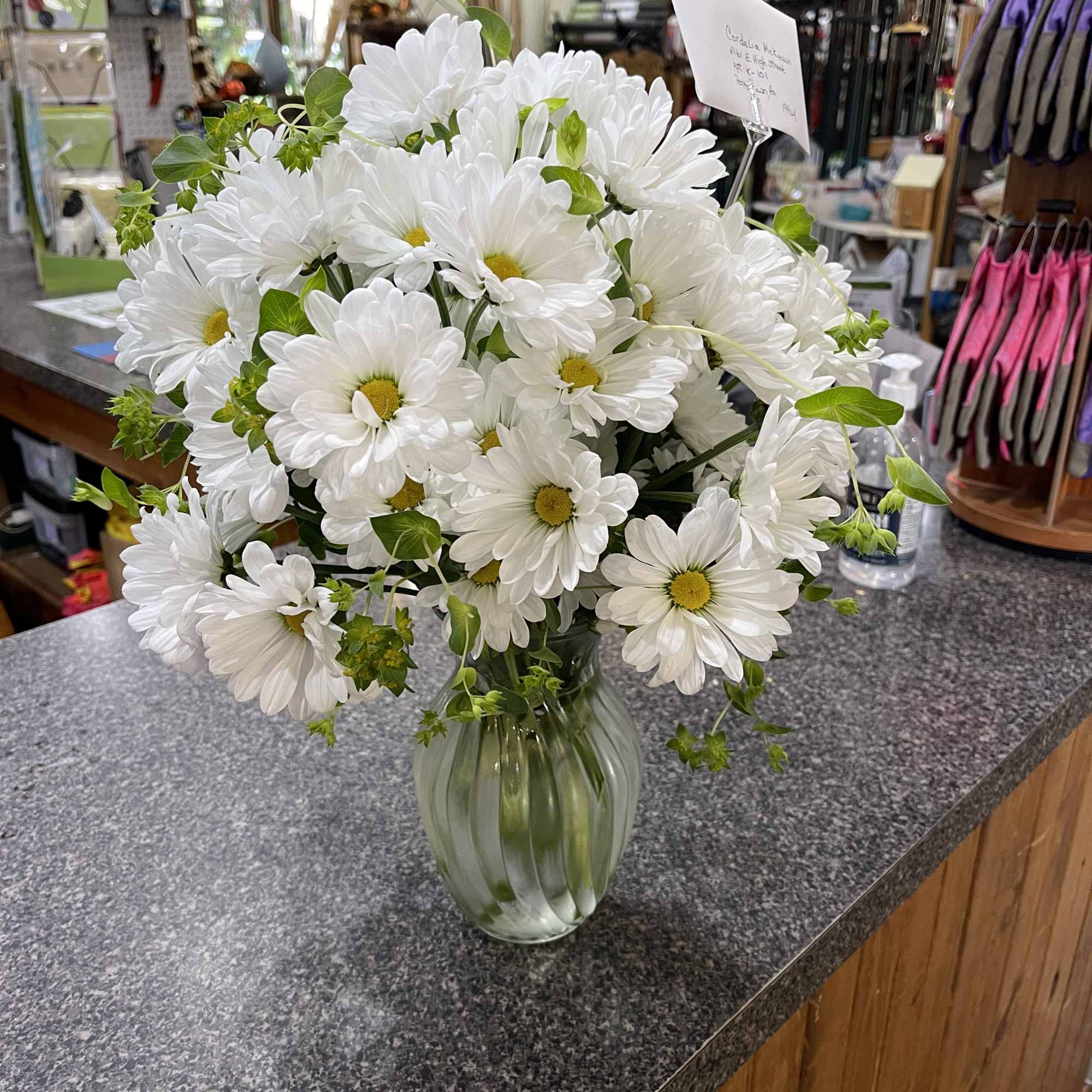 White daisy bouquet in a clear glass vase