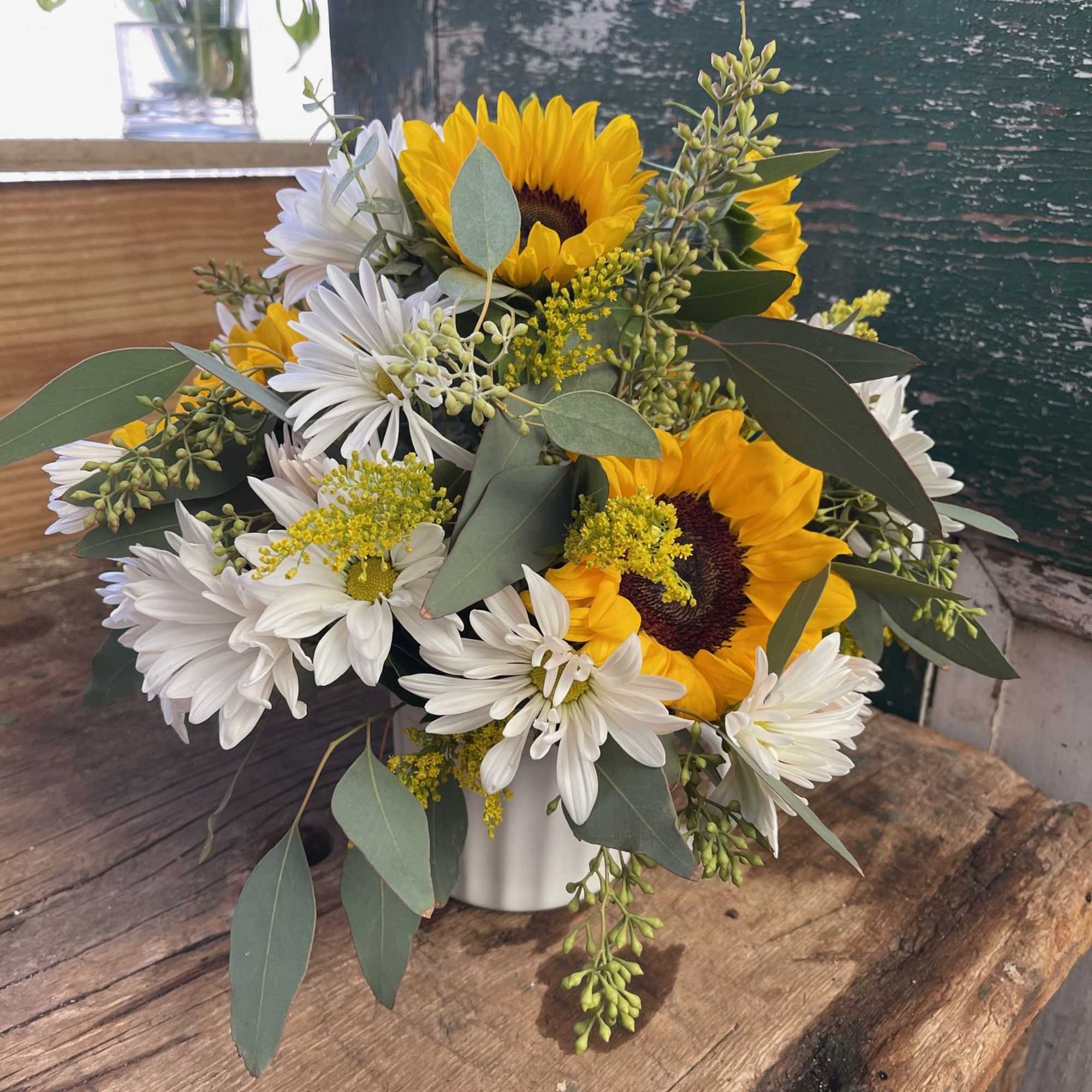 Bouquet of sunflowers and white daisies in a white vase, photo 2 of 3