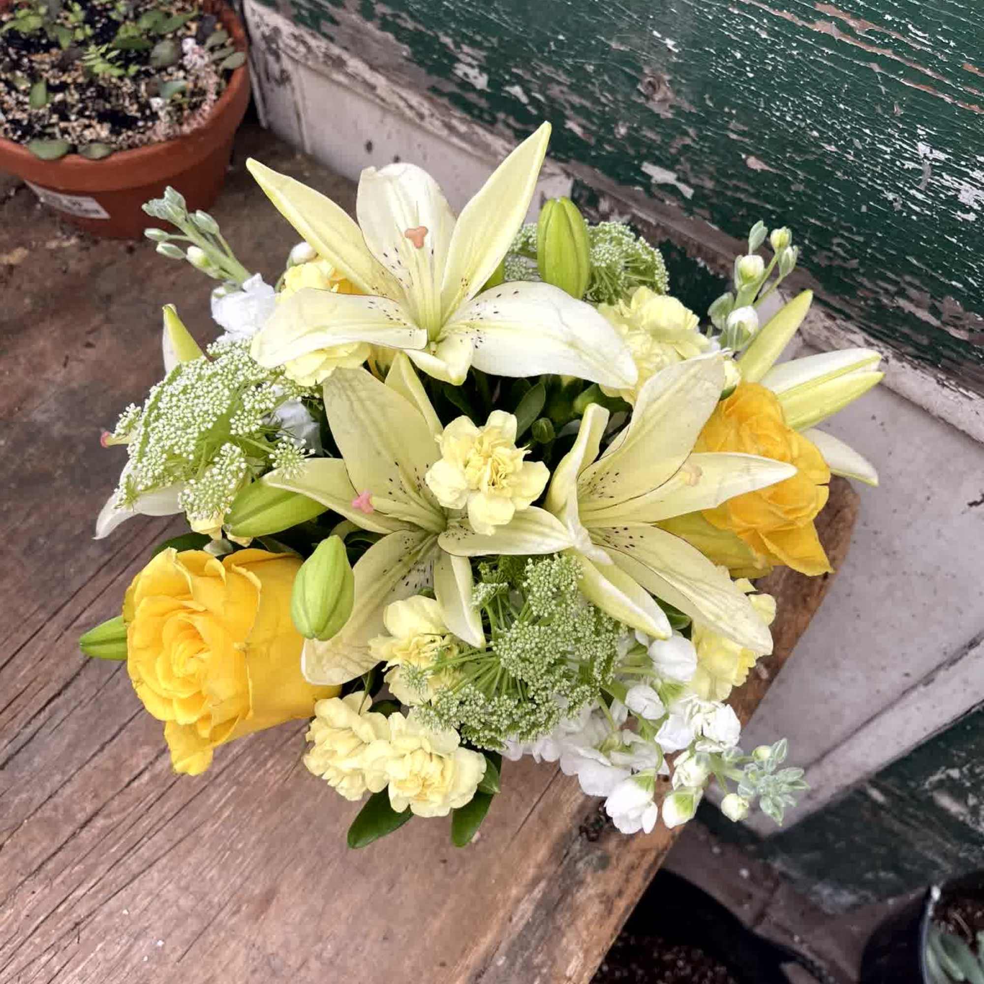 Yellow and white bouquet with lilies and roses