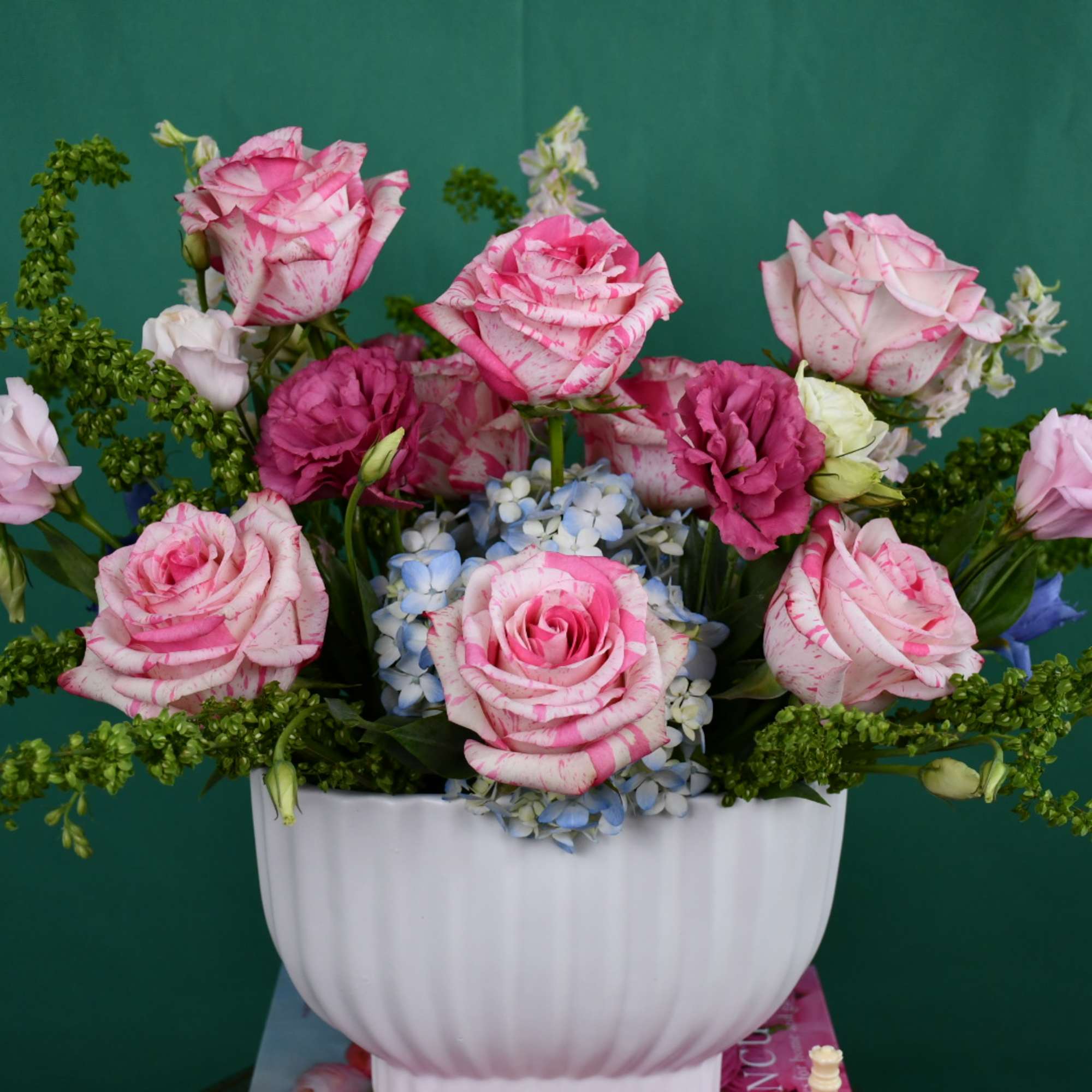 Pink roses and blue hydrangeas in a white vase, photo 2 of 3