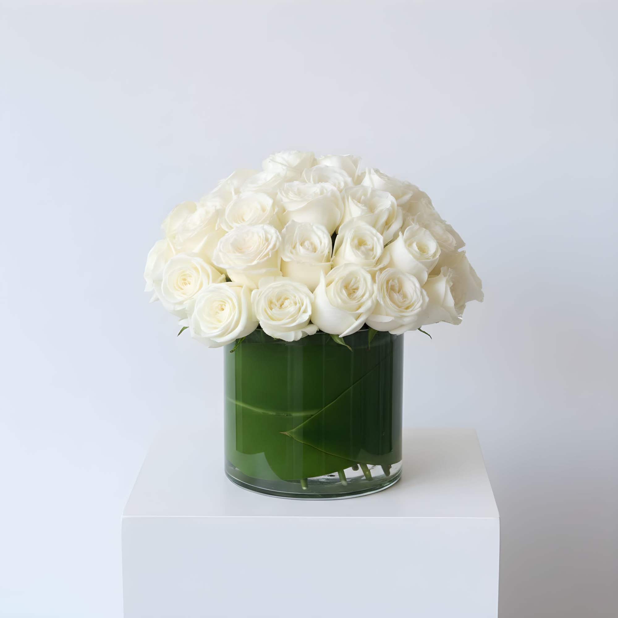 Make a bold statement with this elegantly simple design. White roses symbolize