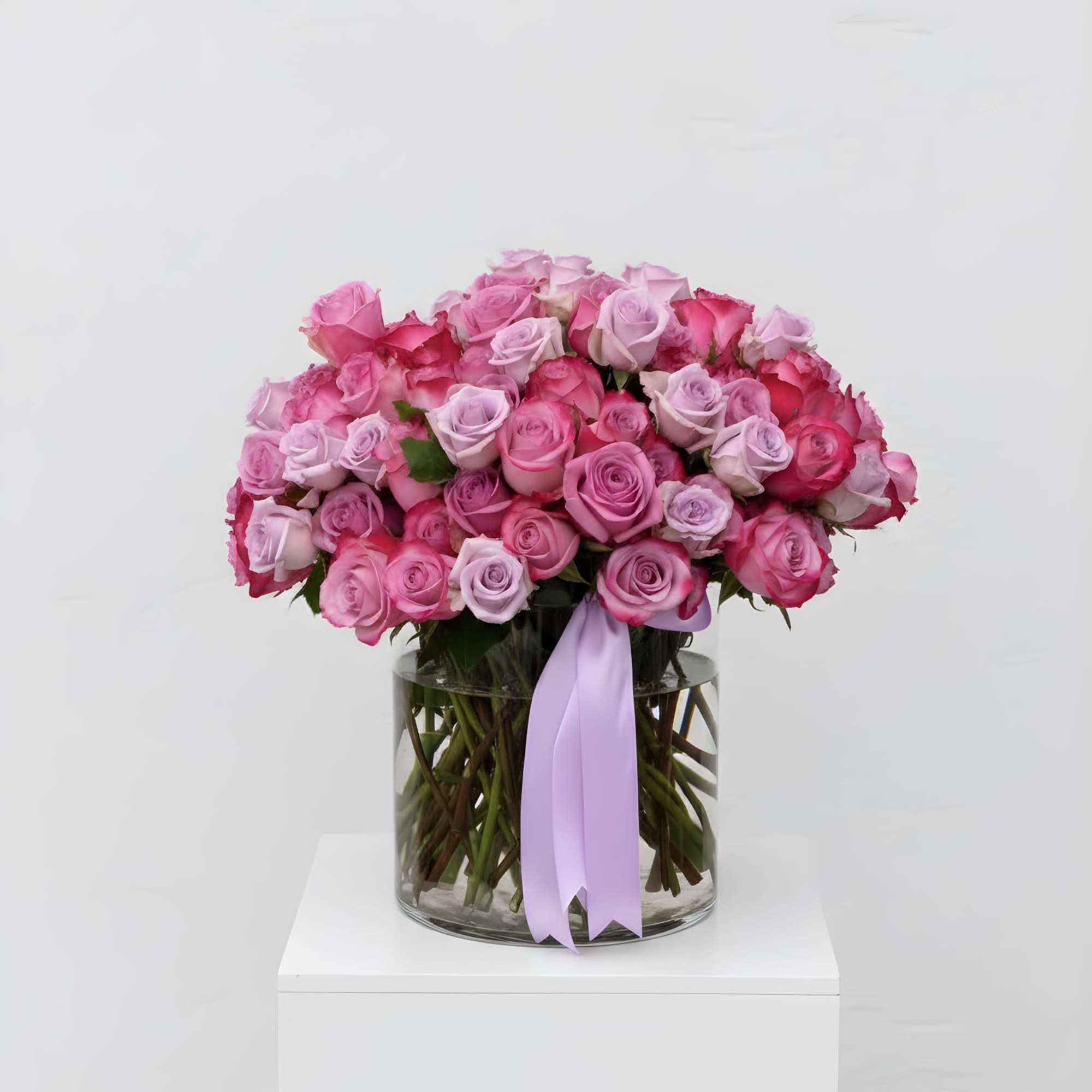This arrangement features a variety of imported, premium roses arranged in a