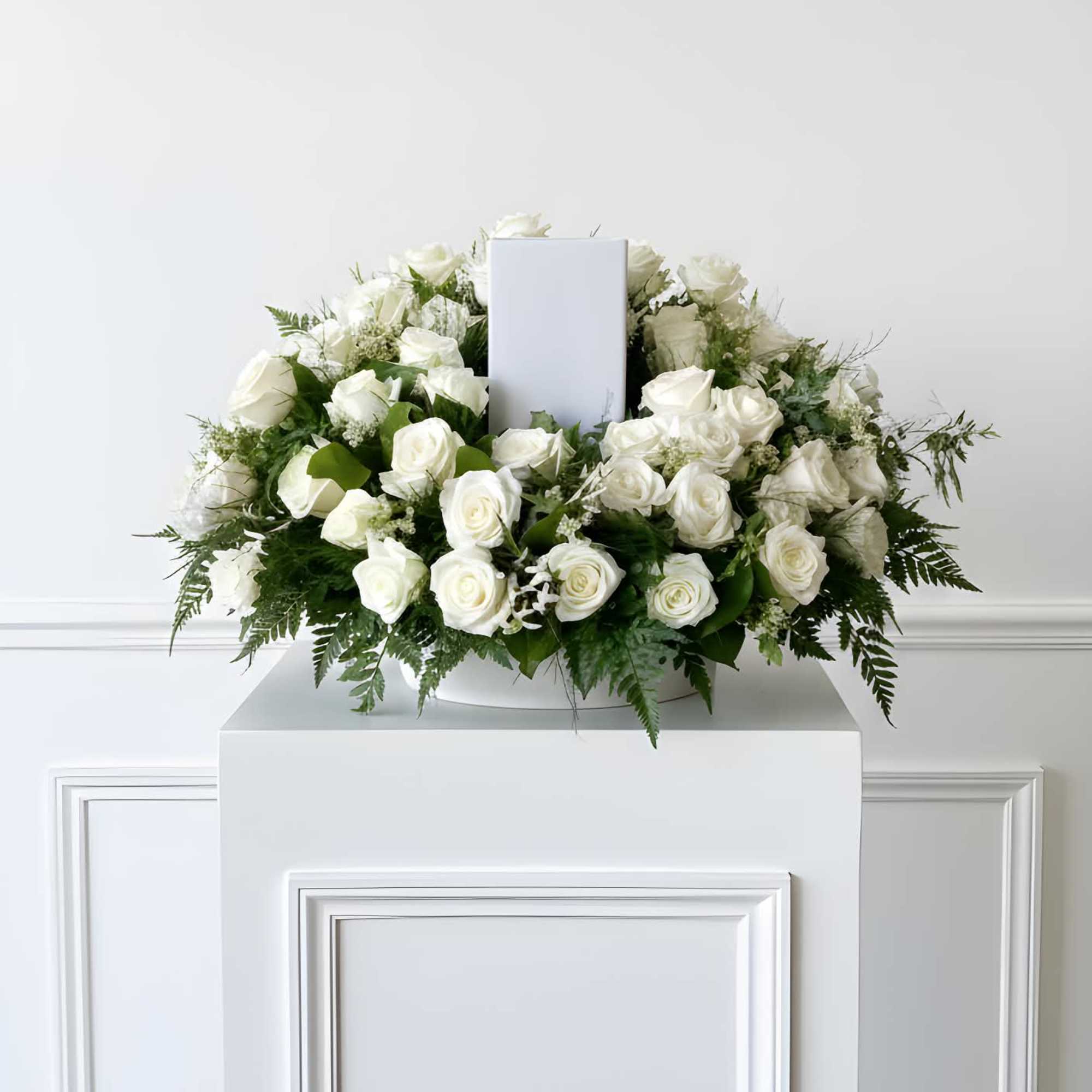 White roses accompanied by a variety of foliage