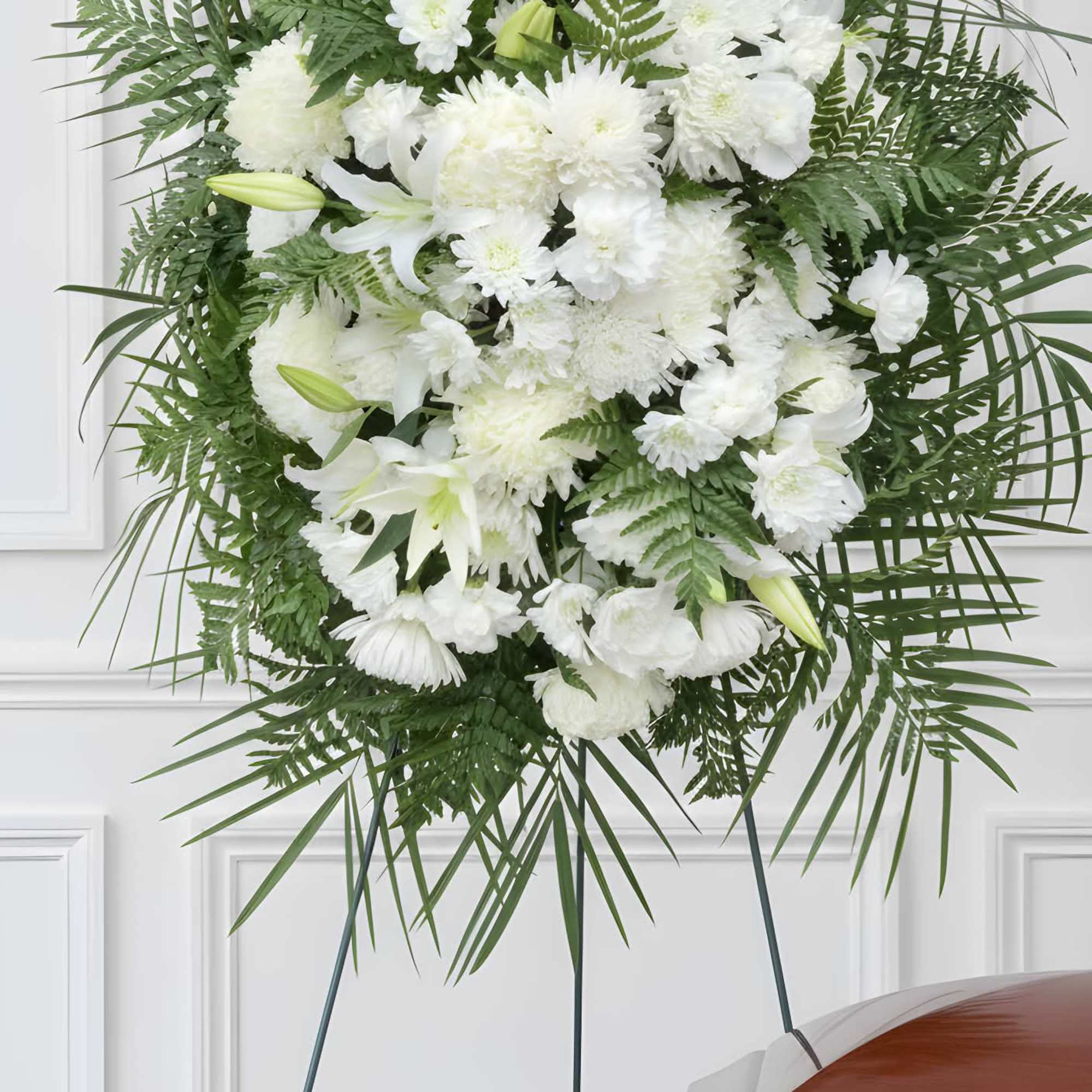 An elegant floor spray composed of whites and greens.