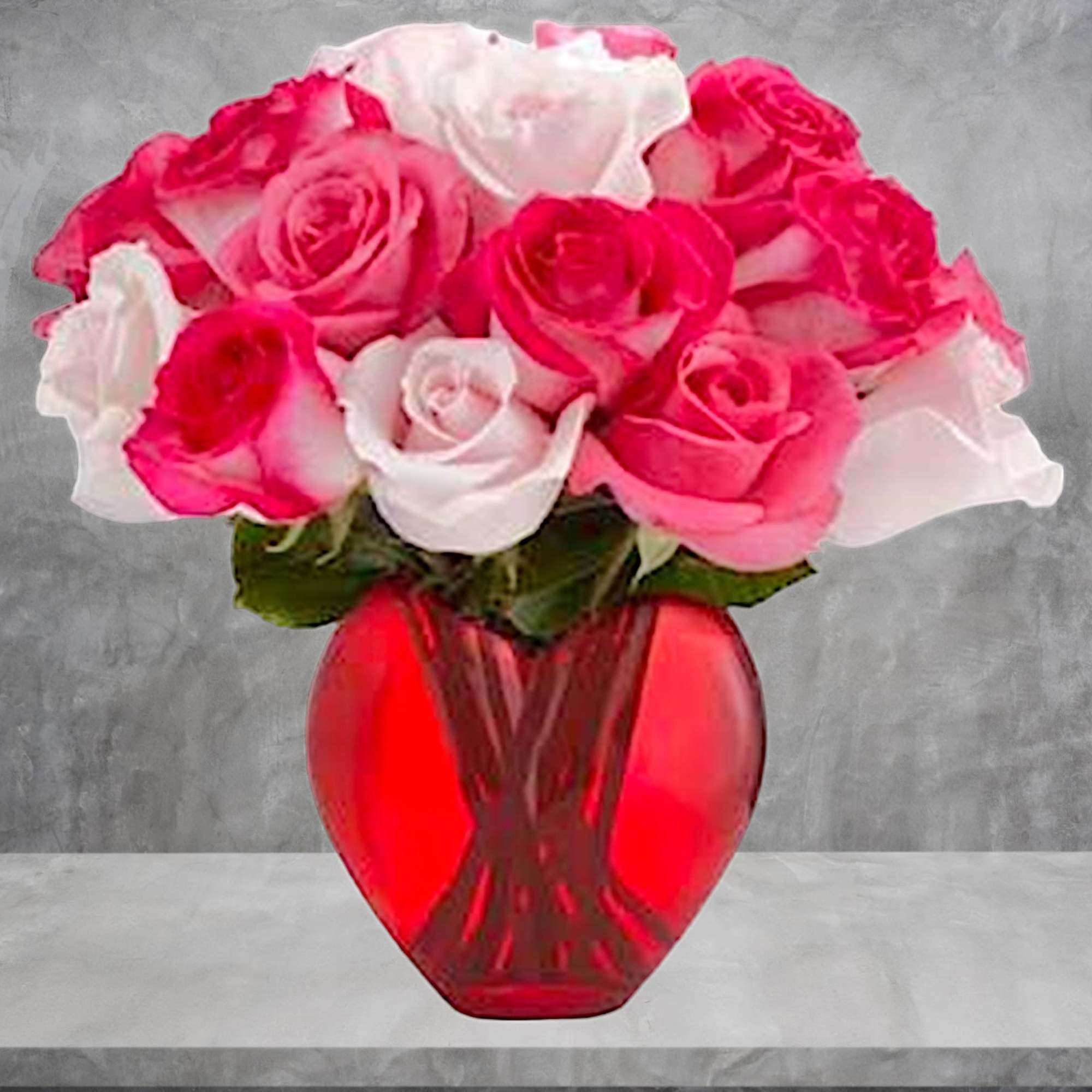 Pink and white roses arranged in a red glass vase, photo 3 of 5