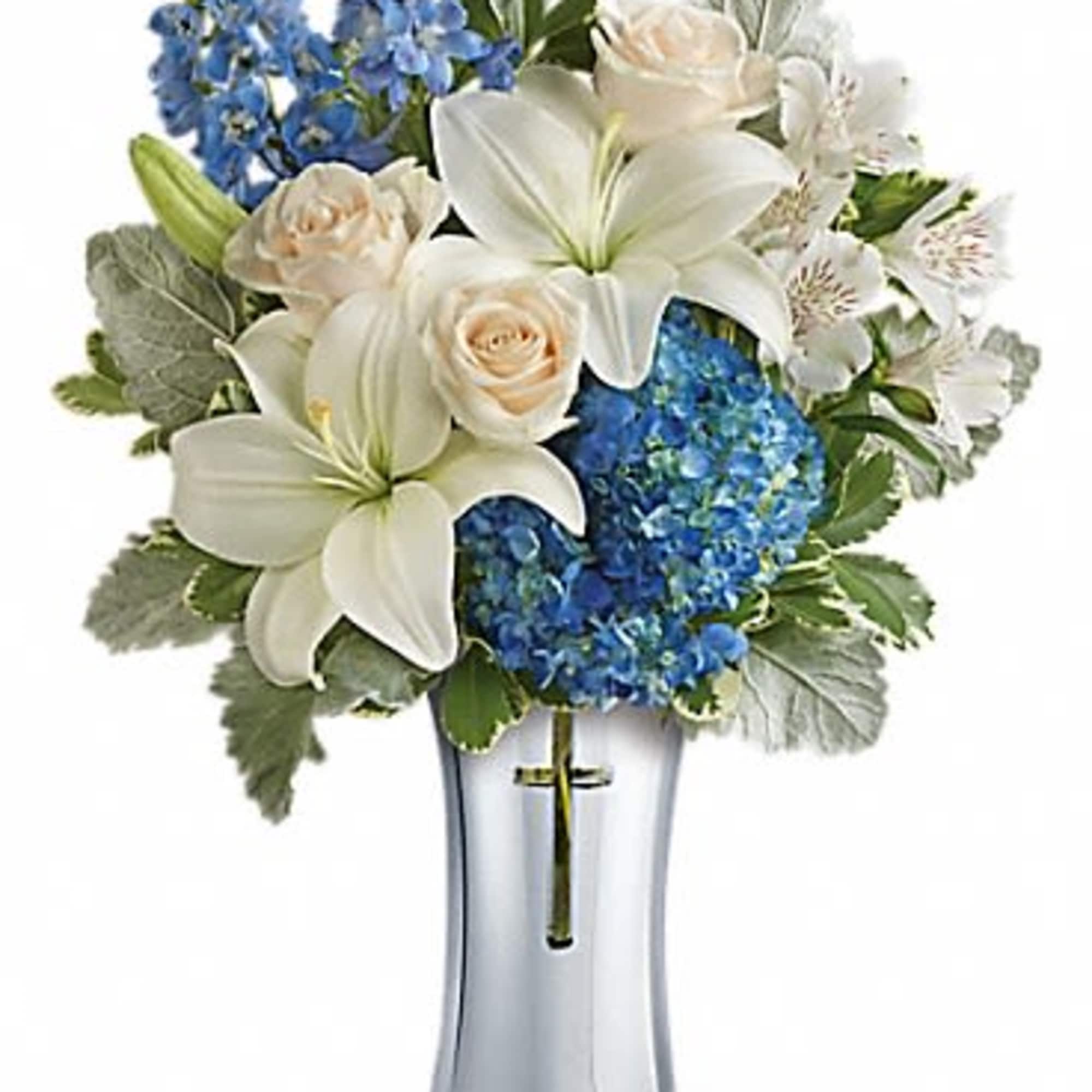 White lilies and blue flowers in a silver vase