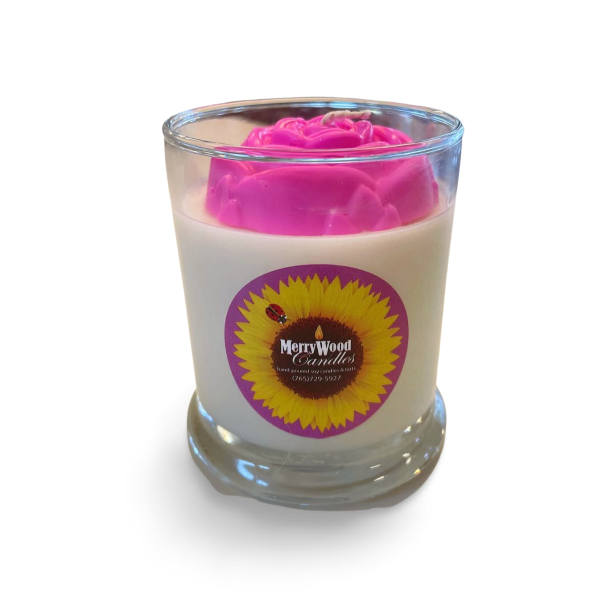 Pink rose-shaped candle in a clear glass tumbler