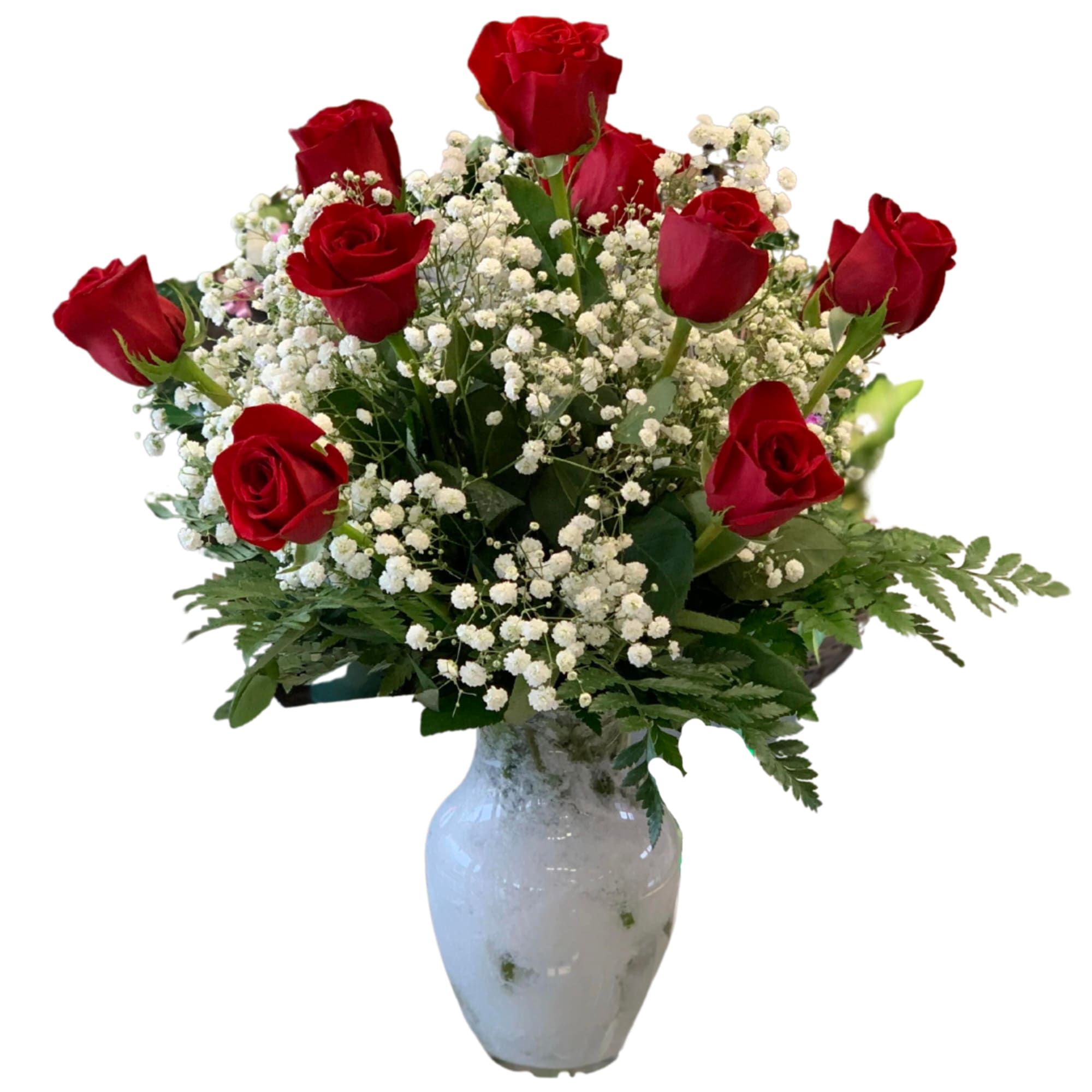 Red roses and baby's breath in a white vase
