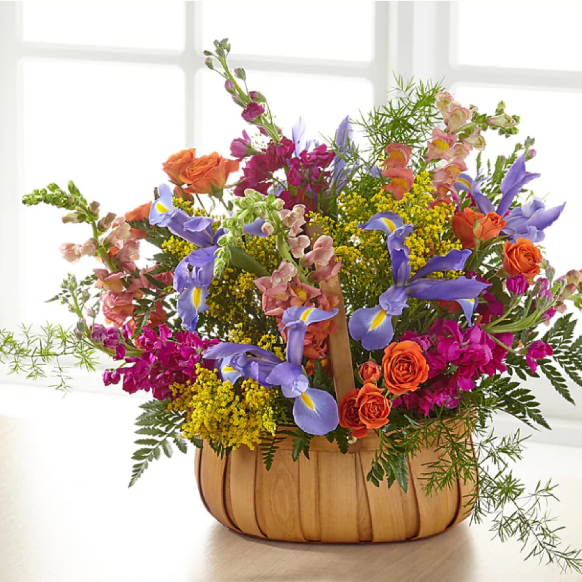 A gorgeous mix of beautiful, bright summer flowers offers an uplifting expression