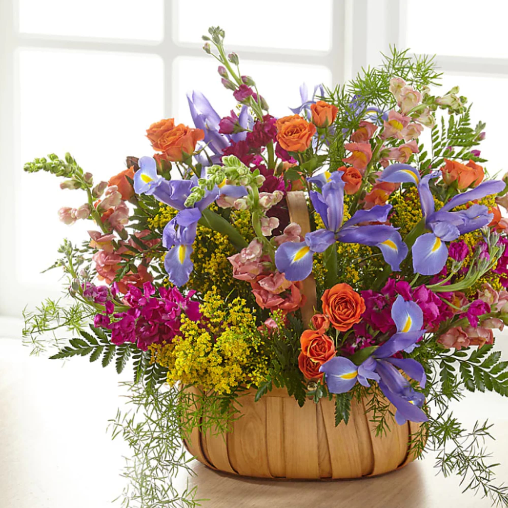 A gorgeous mix of beautiful, bright summer flowers offers an uplifting expression