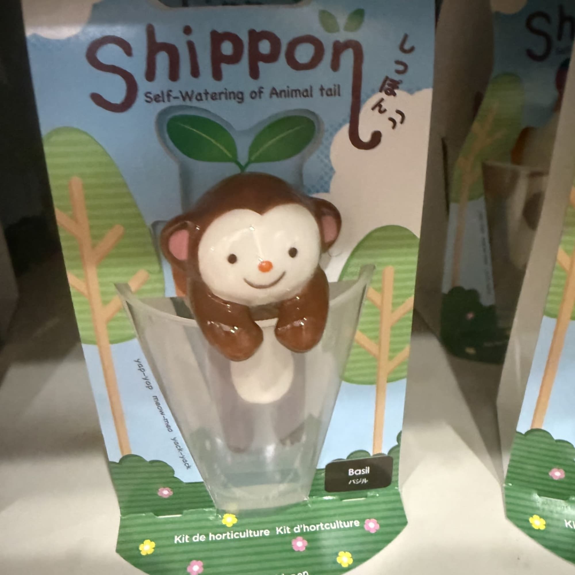 Monkey-shaped self-watering plant kit in retail packaging