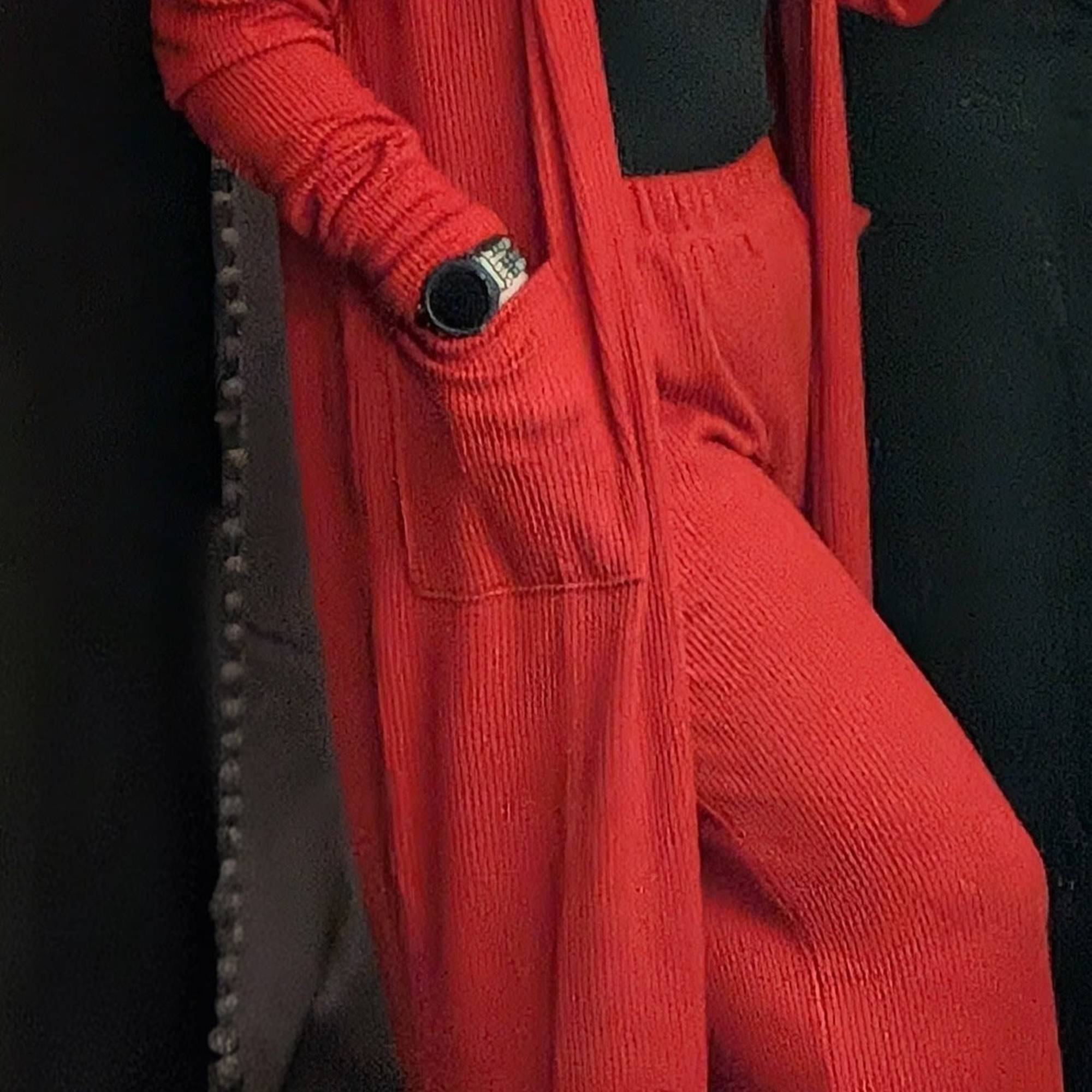 Person wearing a red cardigan and matching pants over a black top, photo 2 of 2