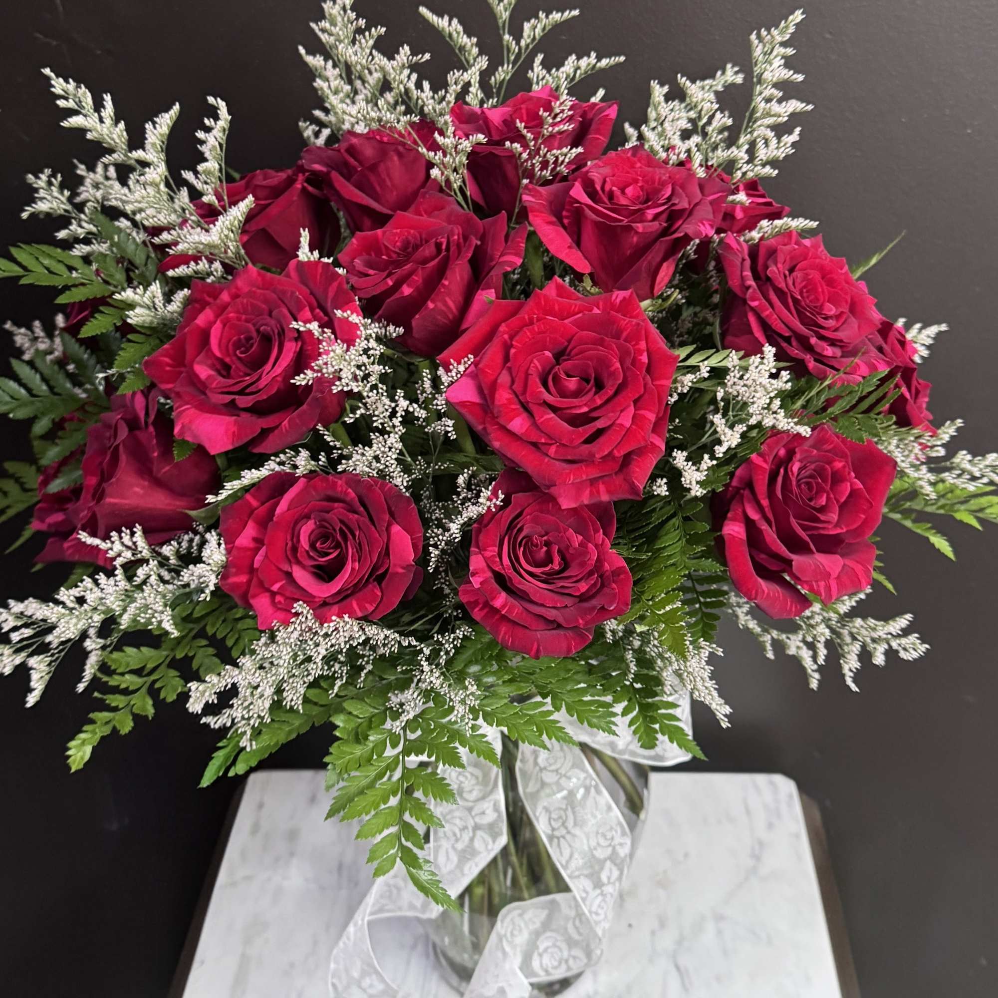 A dozen roses available in Pink, White, Red, Purple, Orange, Yellow with