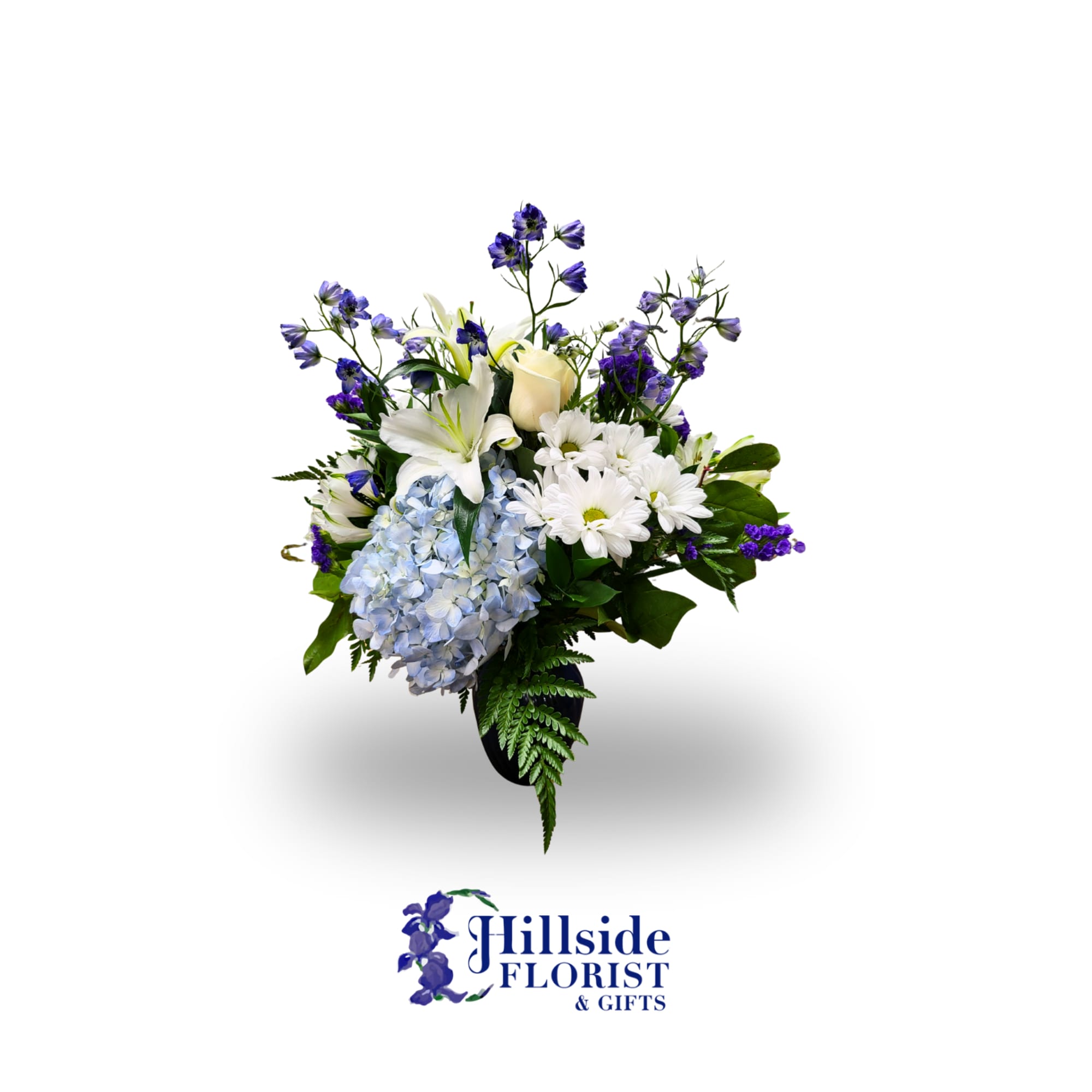 Blue and white floral arrangement with lilies, daisies, and hydrangea