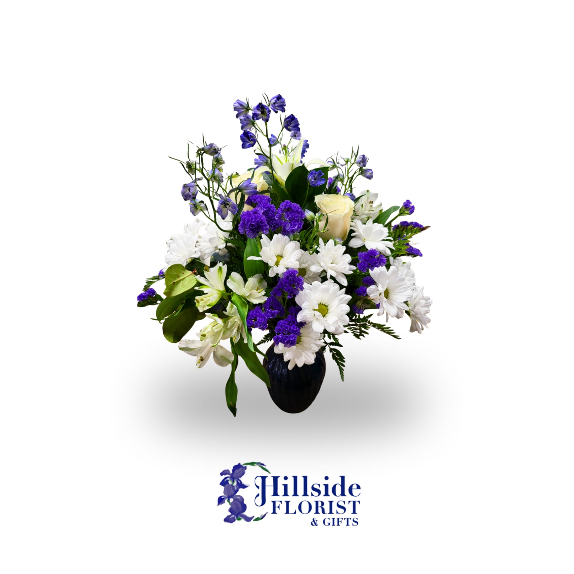 White daisies and roses in a black vase with purple accents