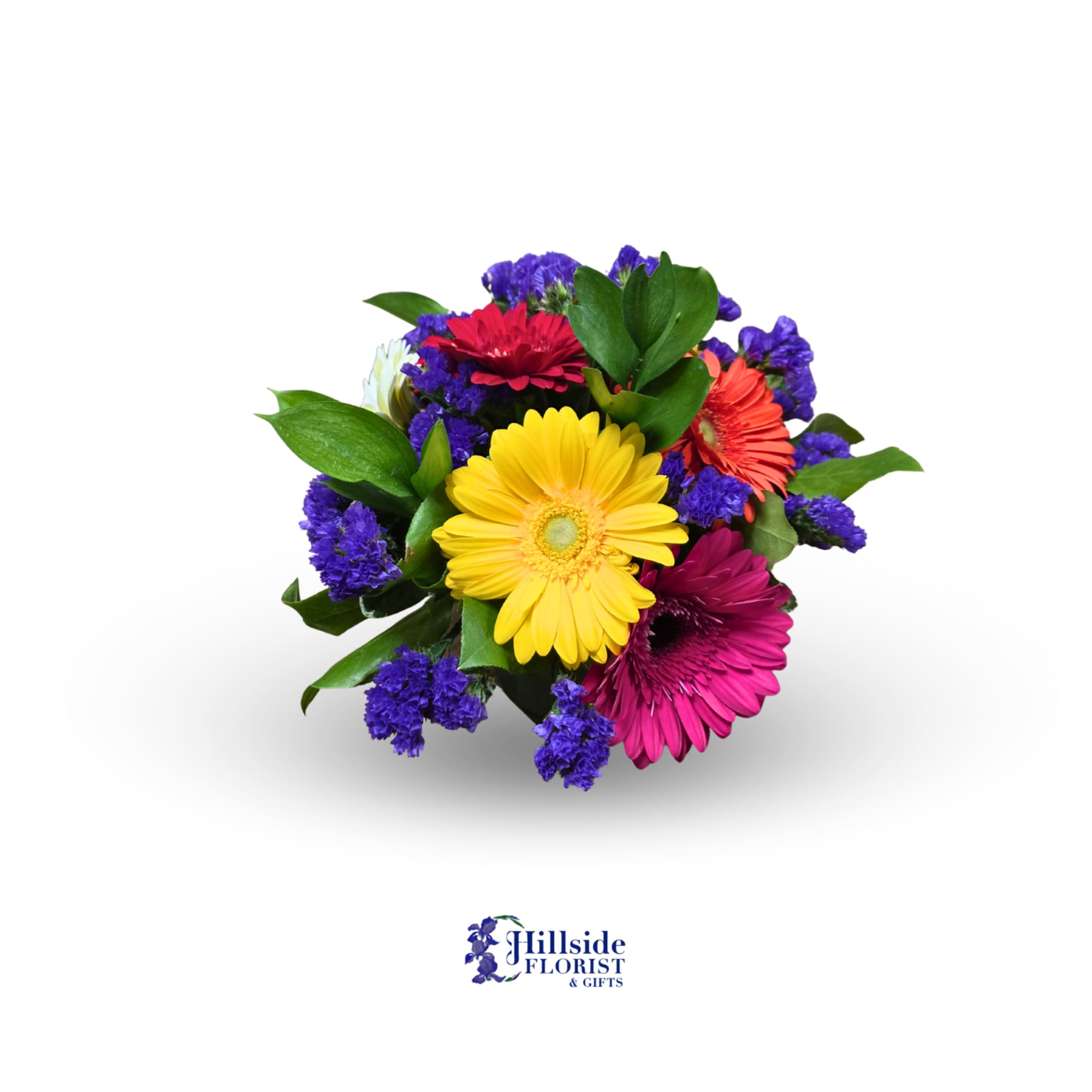 Compact bouquet of bright gerbera daisies with purple accent flowers in a low, rounded cluster