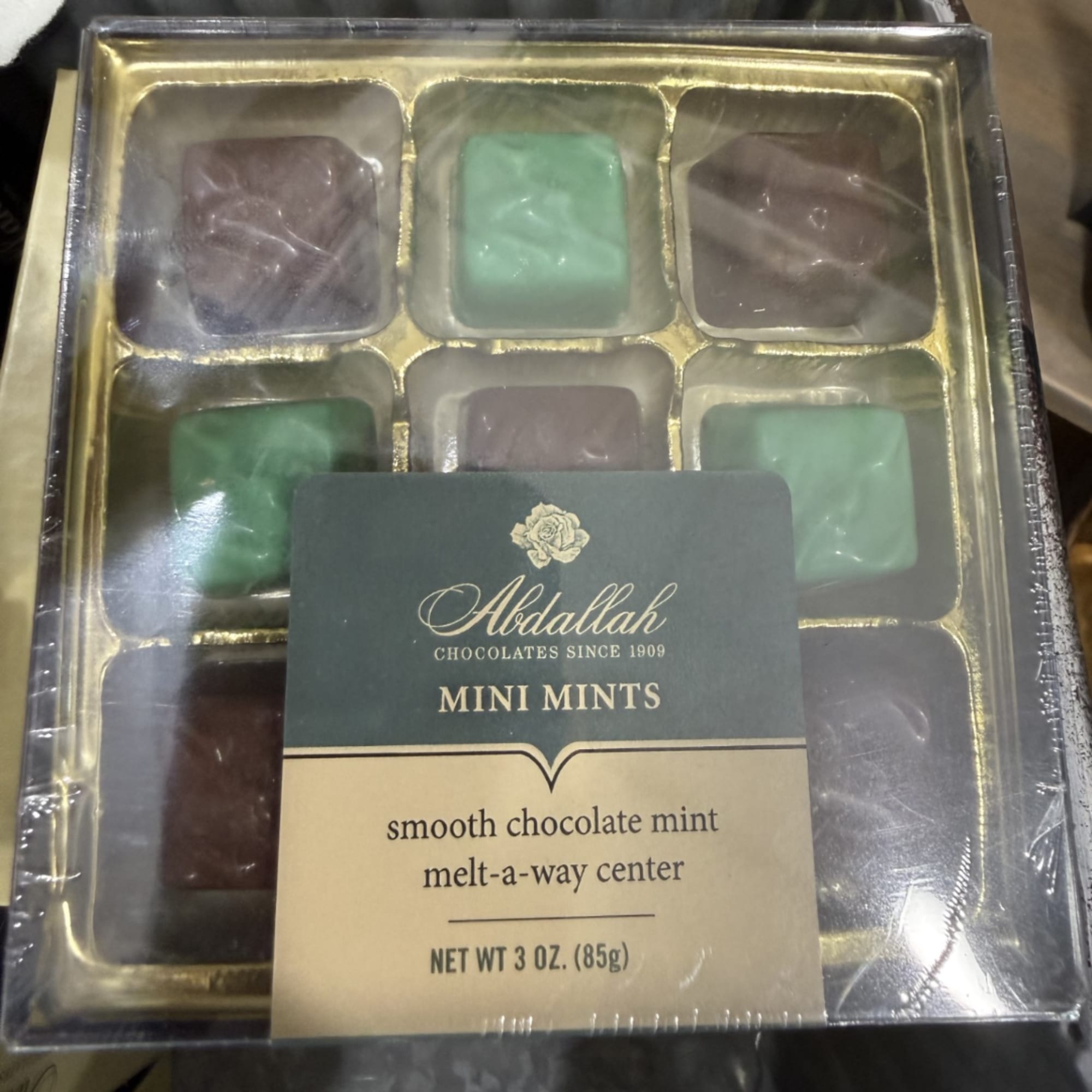Box of assorted mini mint chocolates in a clear plastic tray, photo 2 of 2
