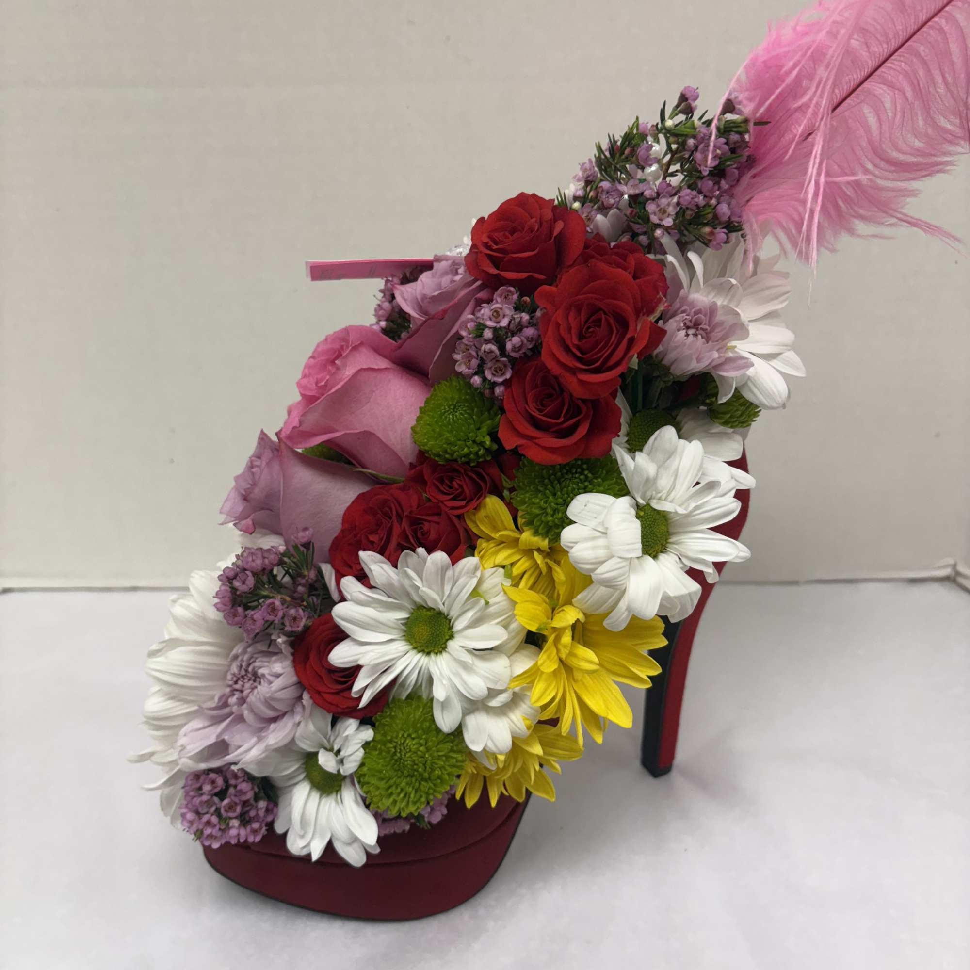 A unique custom flower arrangement in a real high heel shoe! No, photo 2 of 3