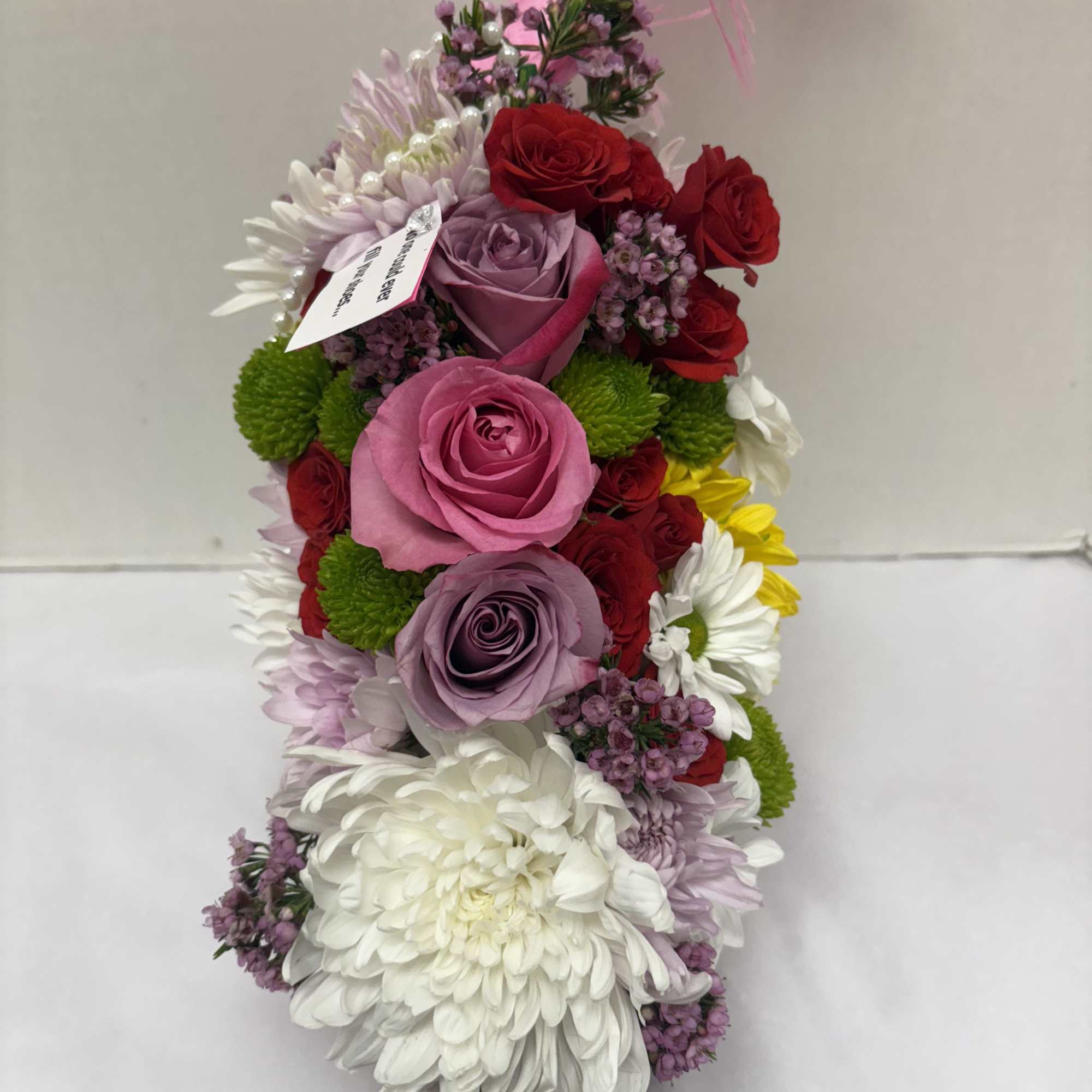 A unique custom flower arrangement in a real high heel shoe! No, photo 3 of 3