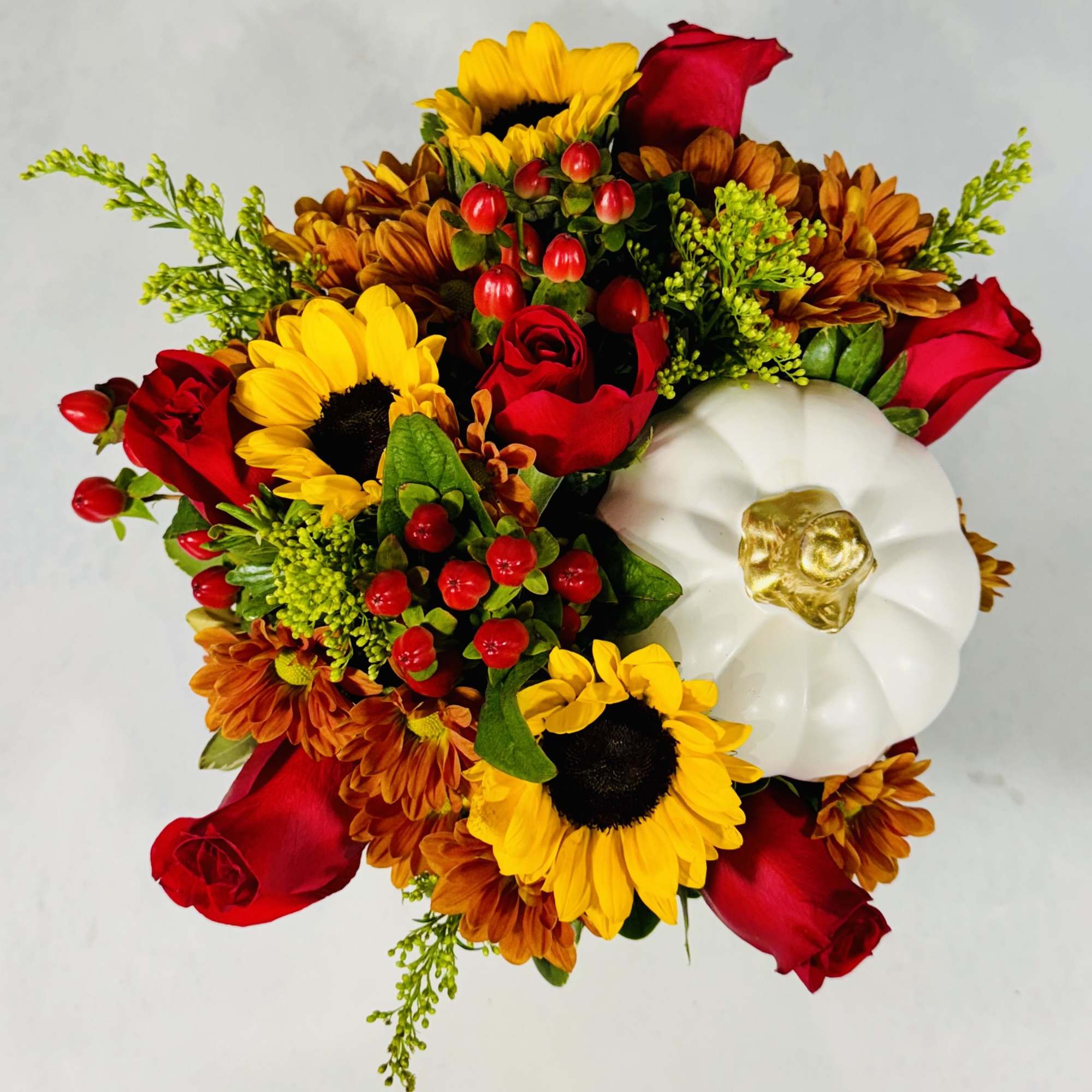 Bouquet with red roses, sunflowers, orange mums, and a white pumpkin