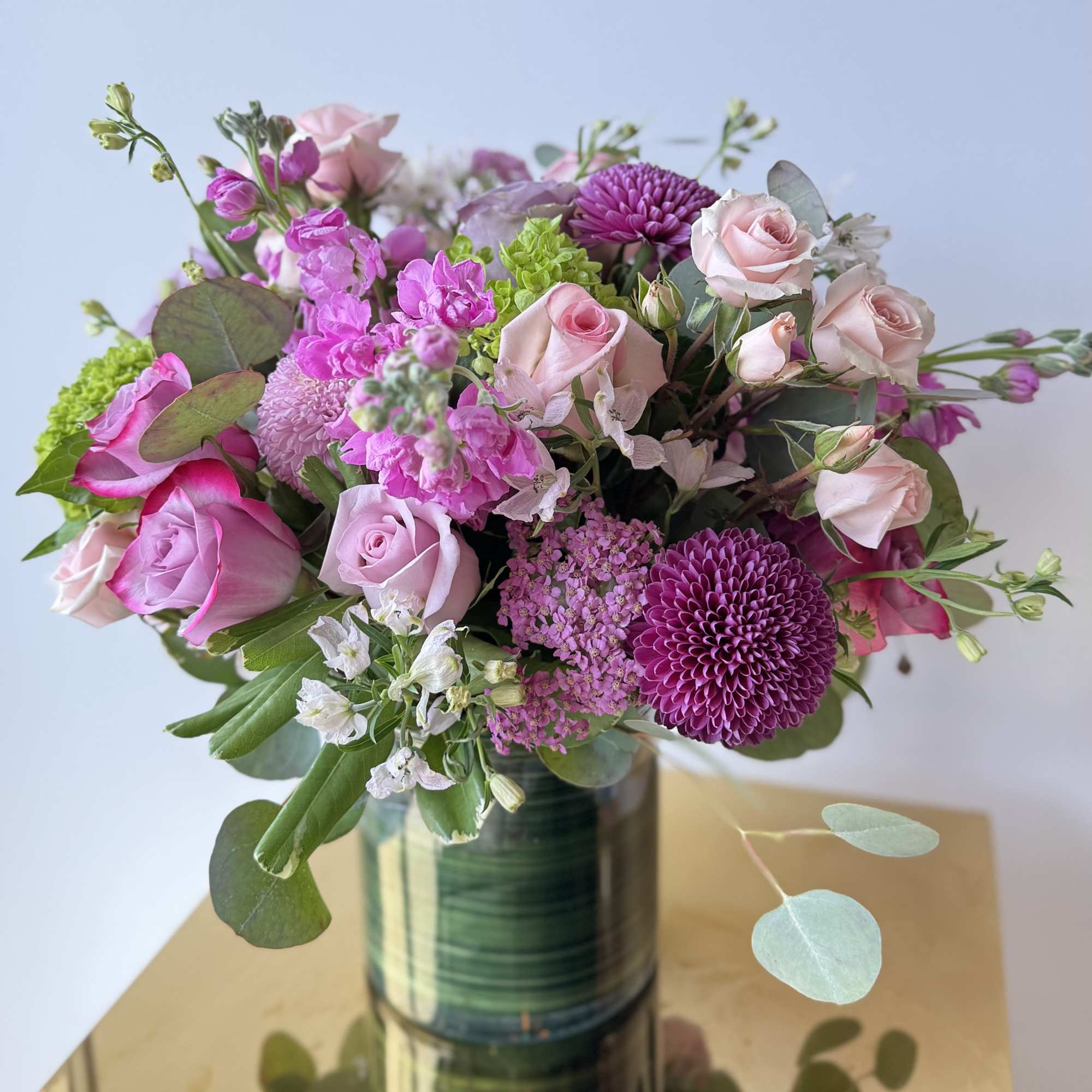 Delight someone special with this elegant arrangement of fresh blush, lavender, and