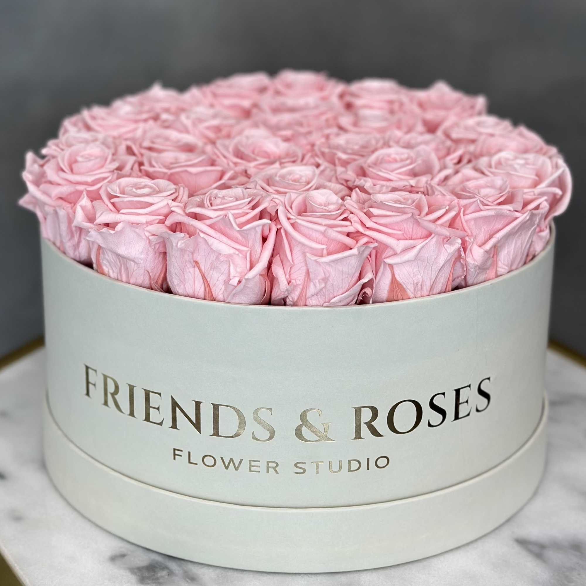Round box of pink roses