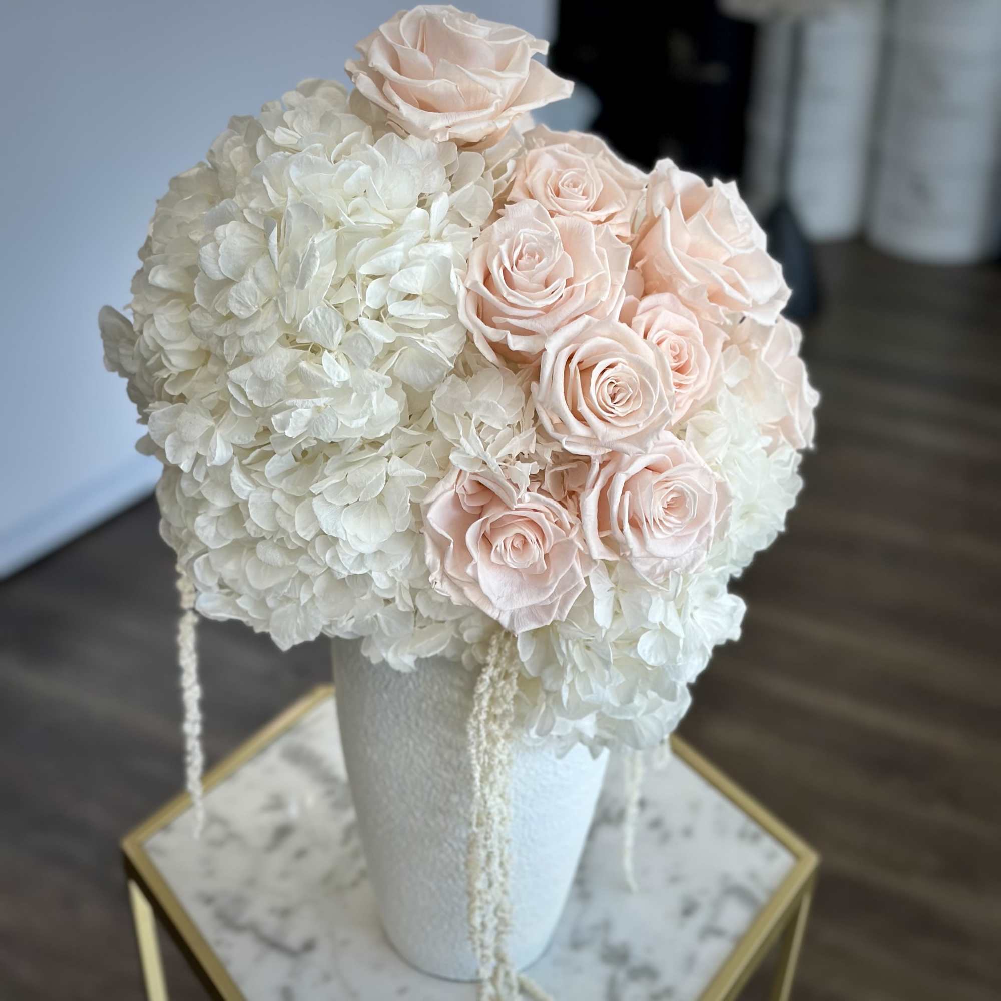 Cloud-like white hydrangeas and delicate blush roses come together in an effortlessly, photo 2 of 2