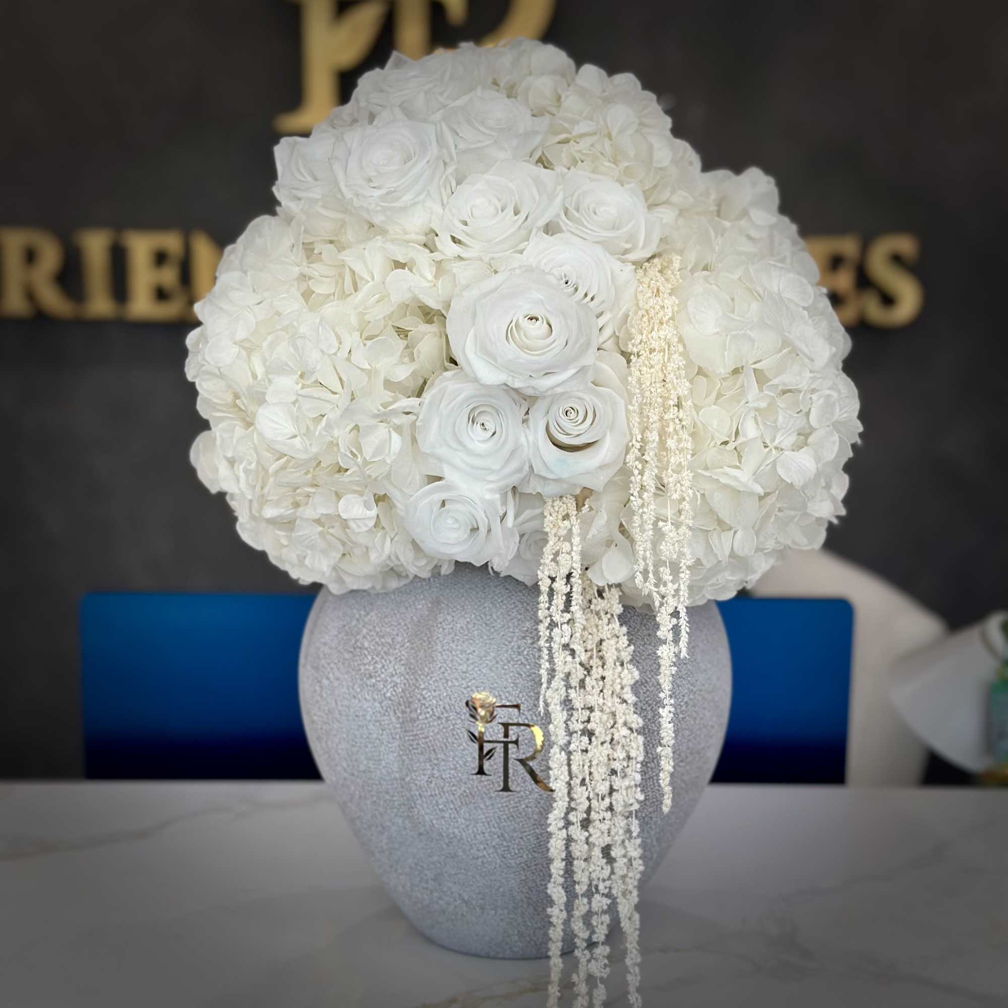 A breathtaking all-white arrangement designed to embody sophistication and serenity. Featuring lush, photo 3 of 3