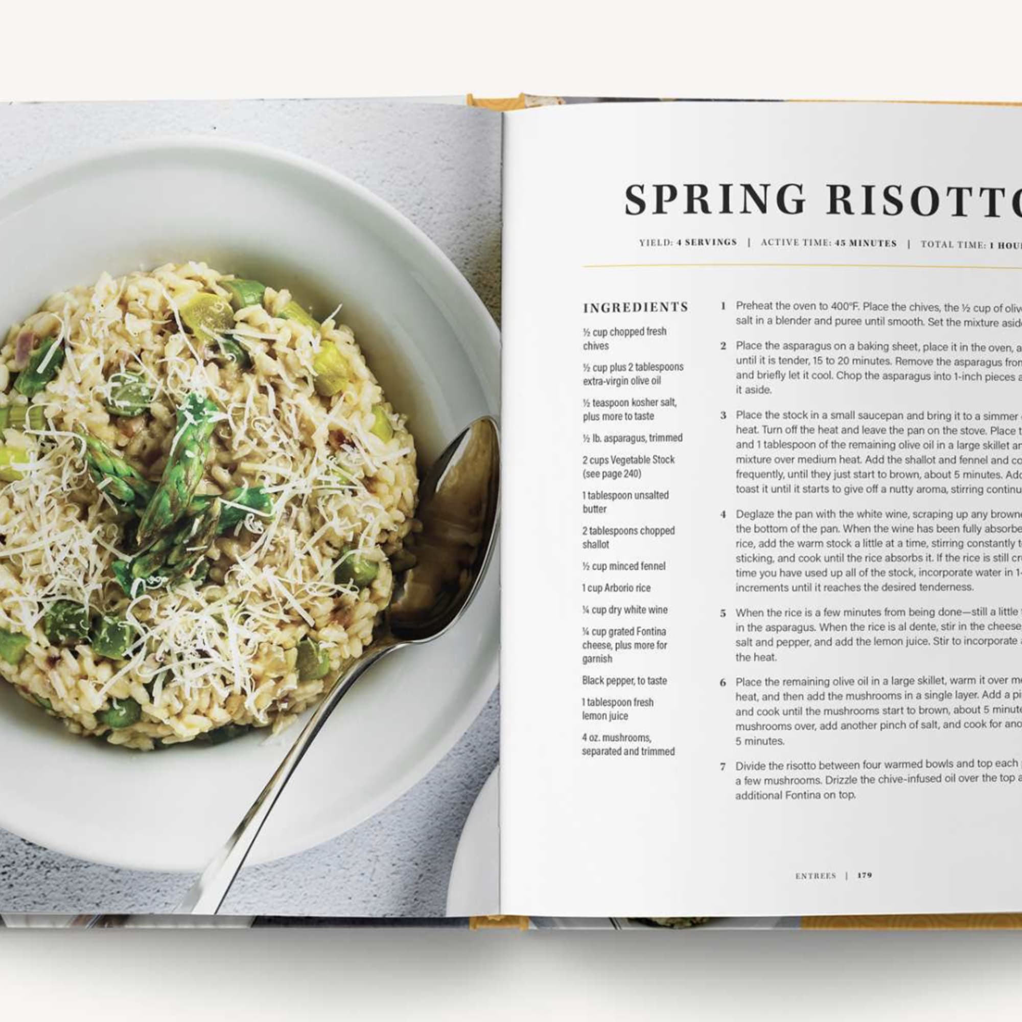 Open cookbook showing a bowl of spring risotto and a recipe page