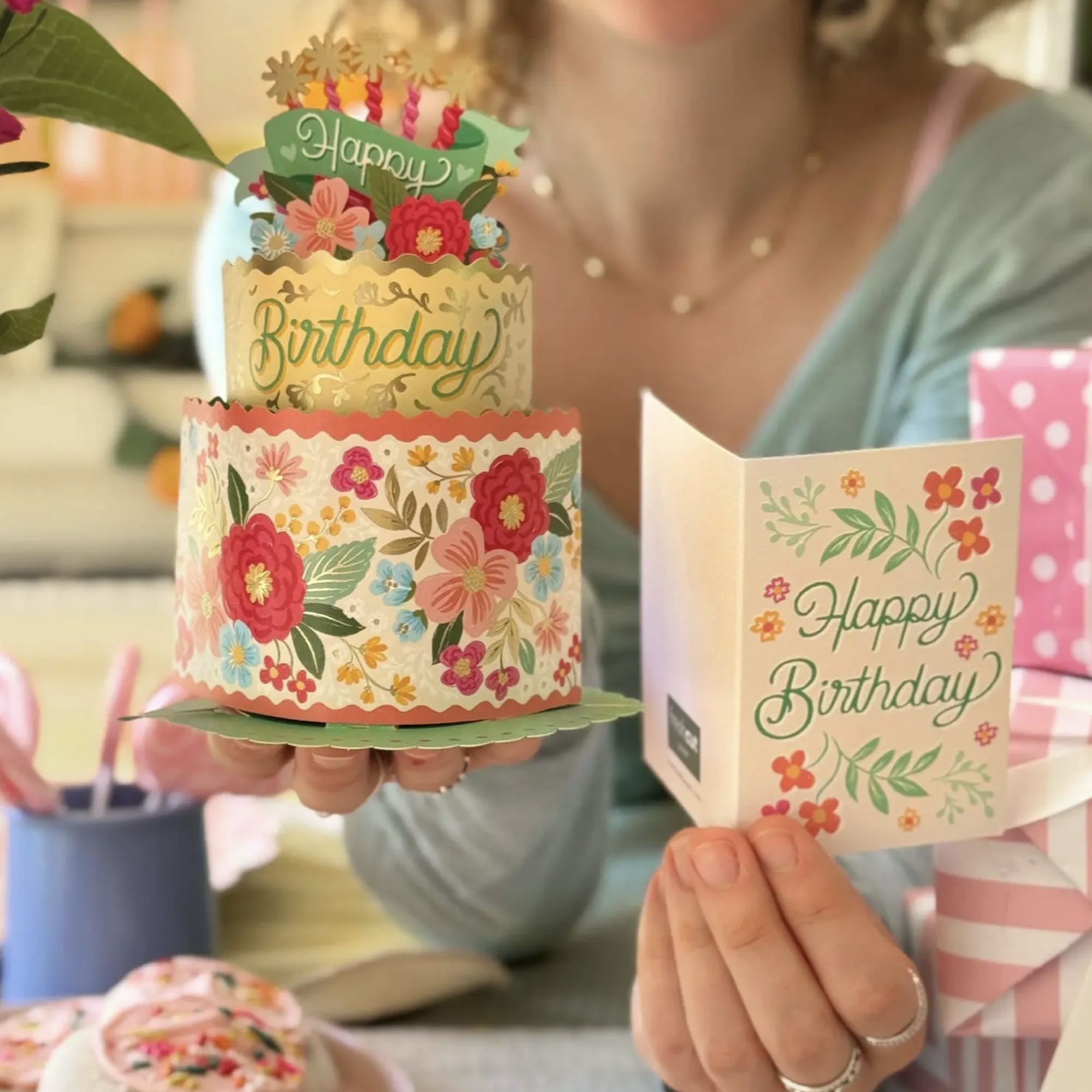 Birthday card and paper cake topper with floral decorations