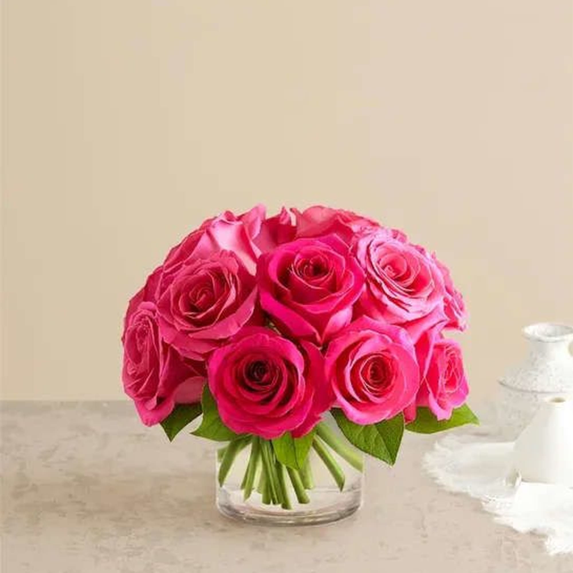 Pink rose bouquet in a clear glass vase