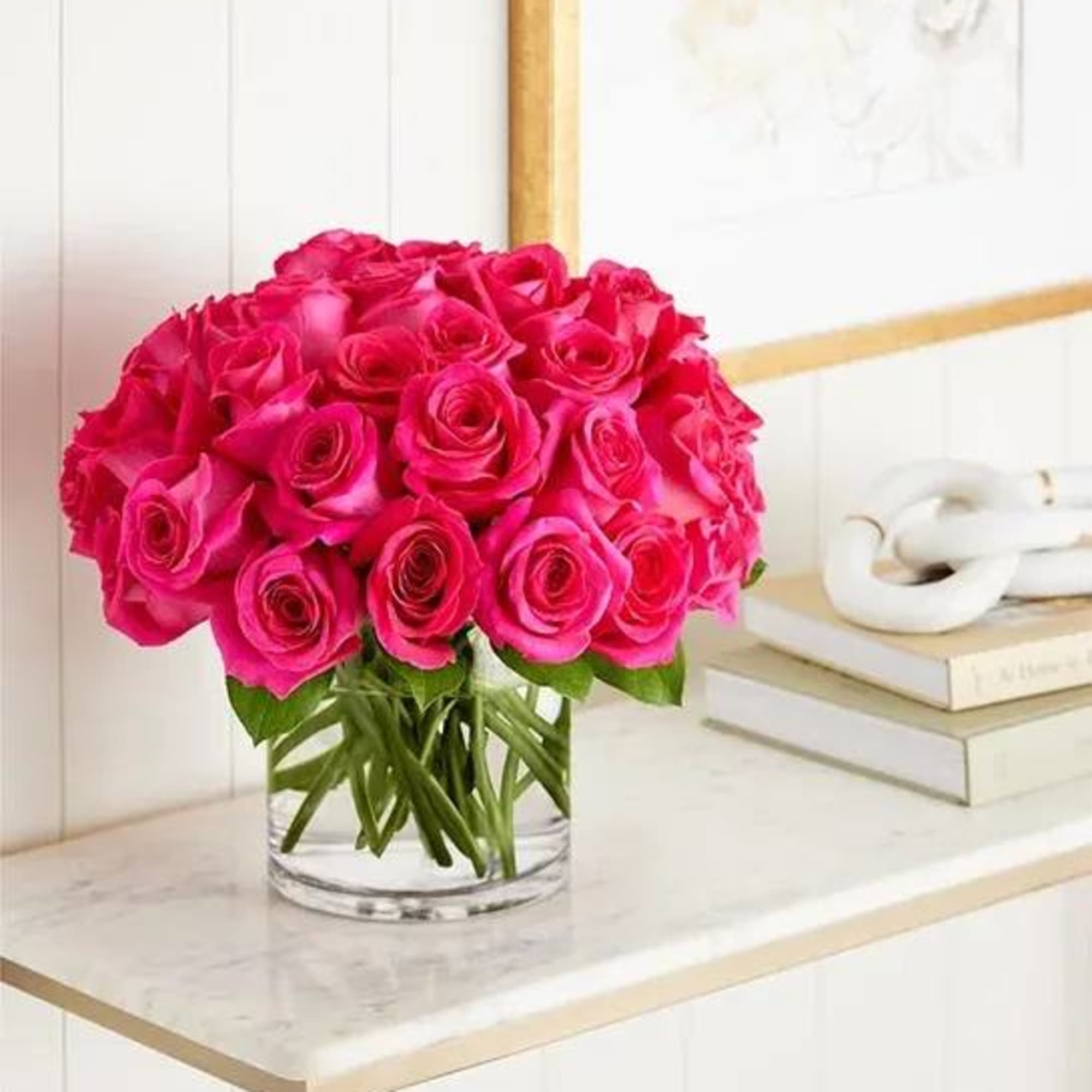 Bouquet of bright pink roses in a clear glass vase, photo 3 of 4