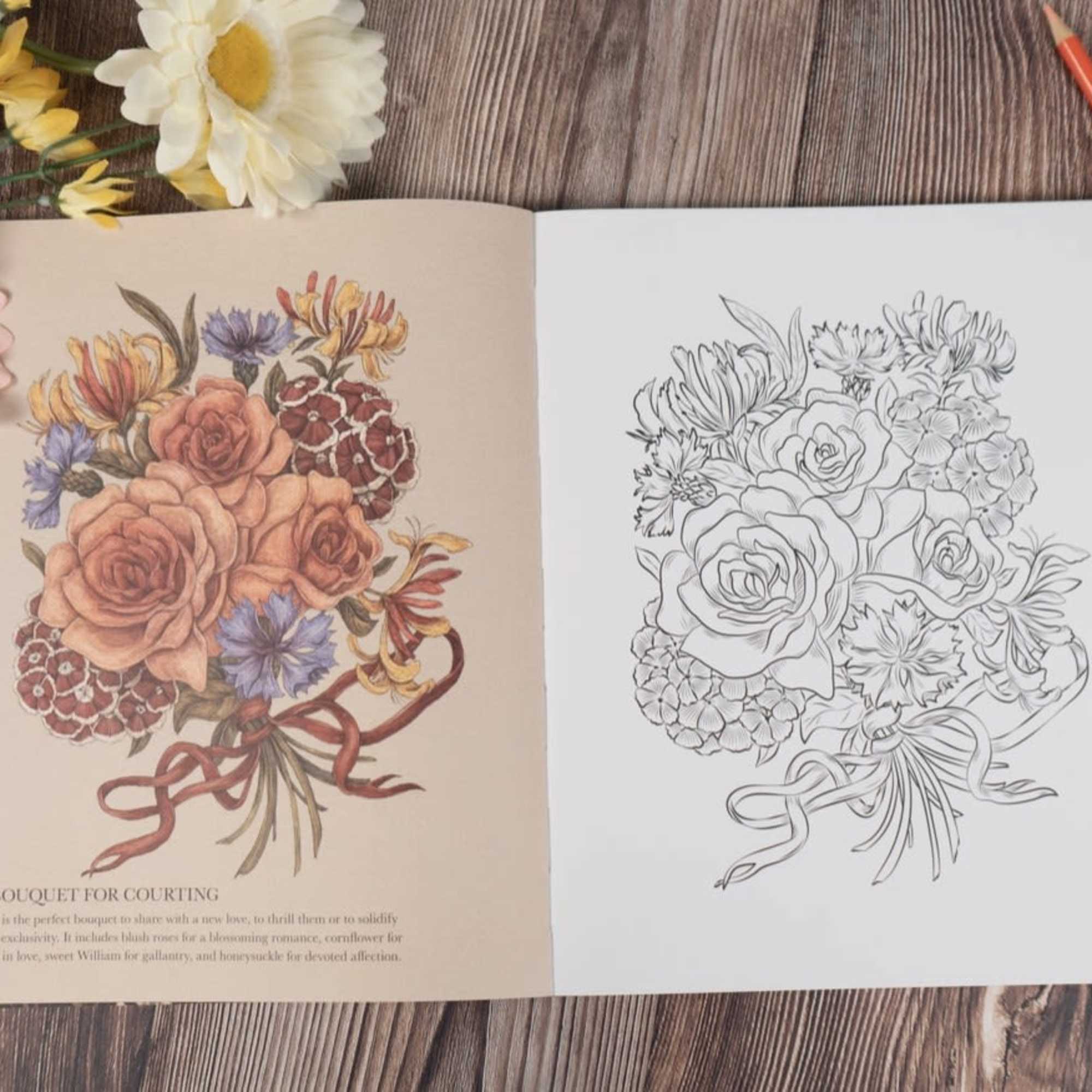 Open coloring book with a floral bouquet illustration and colored pencils nearby