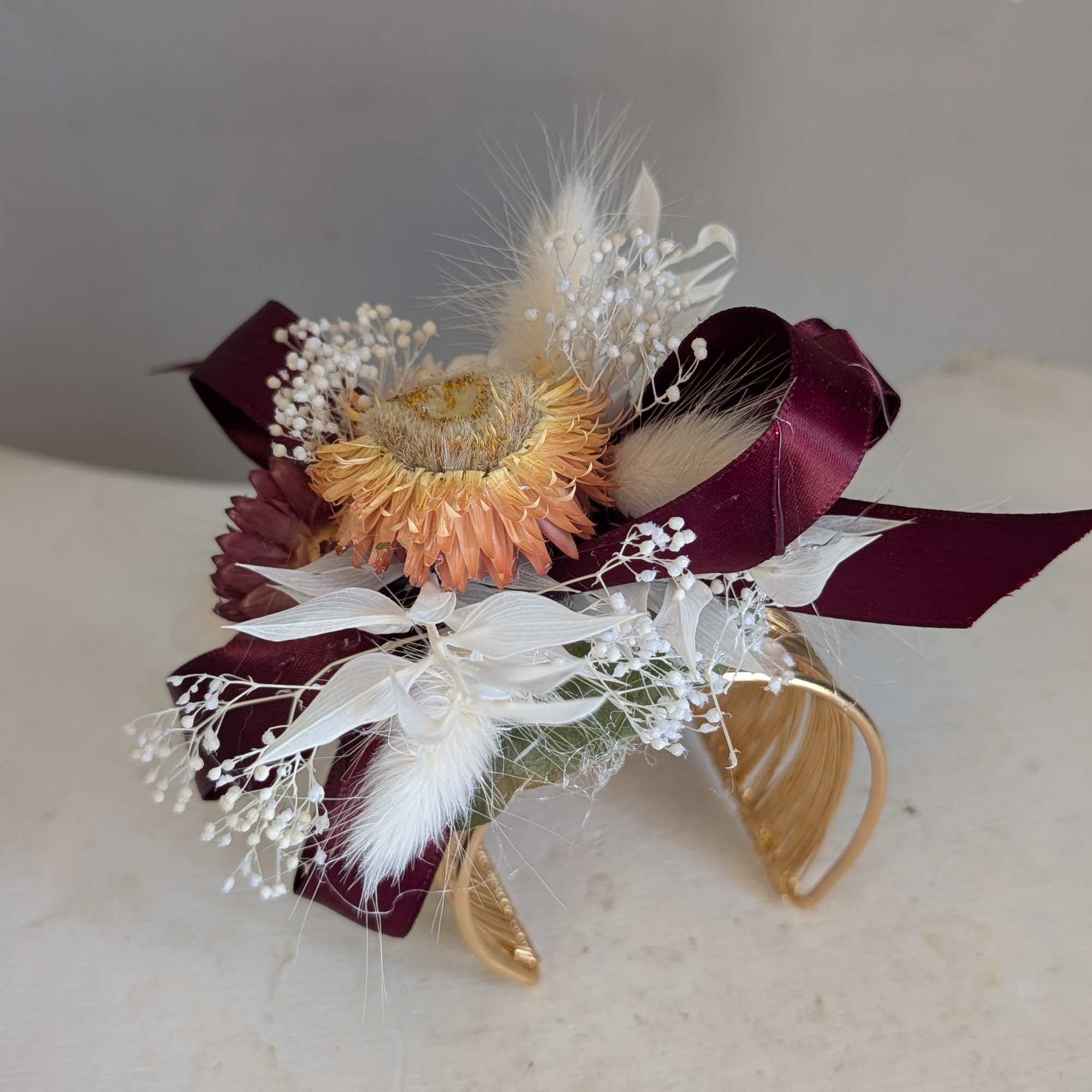 A compact dried corsage built to make the person you're thinking of