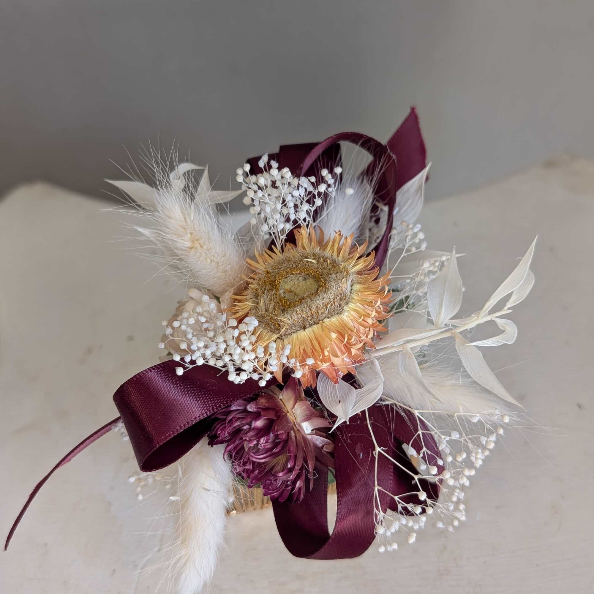 A compact dried corsage built to make the person you're thinking of, photo 2 of 2